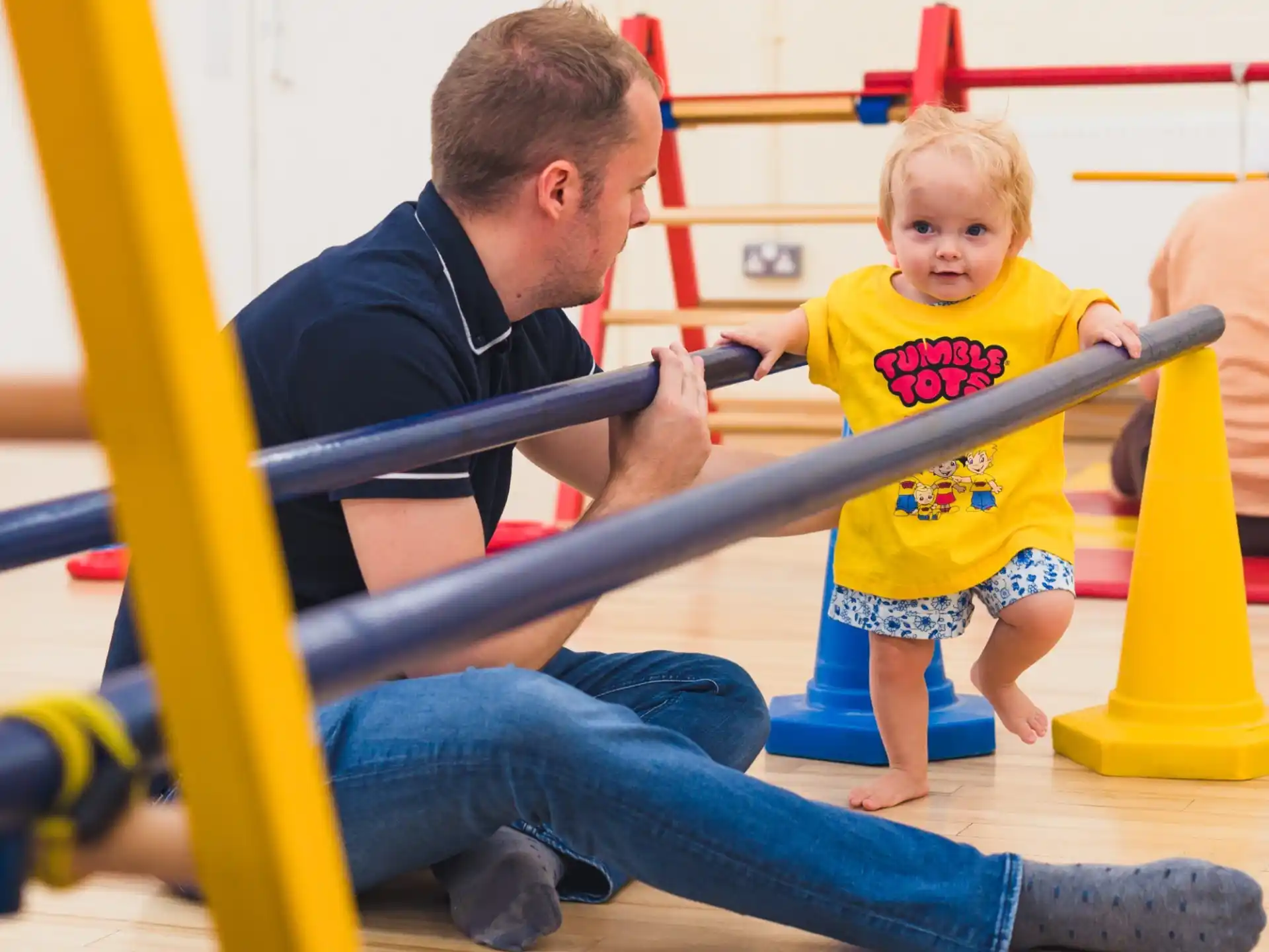 a person and a child playing on a playground
