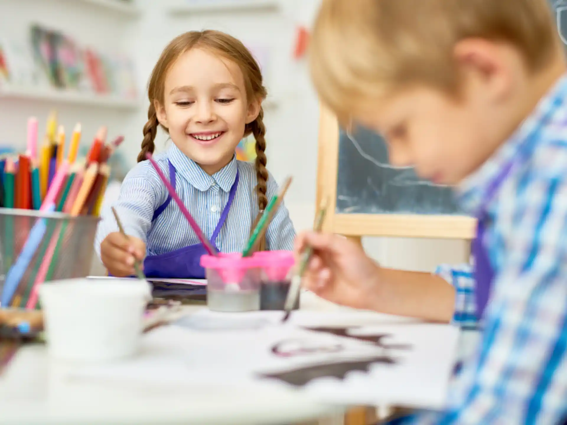 a boy and girl painting