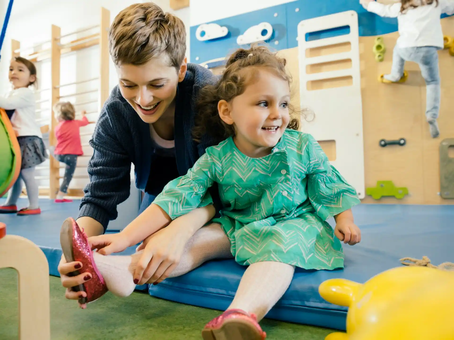 a couple of children playing on a playground