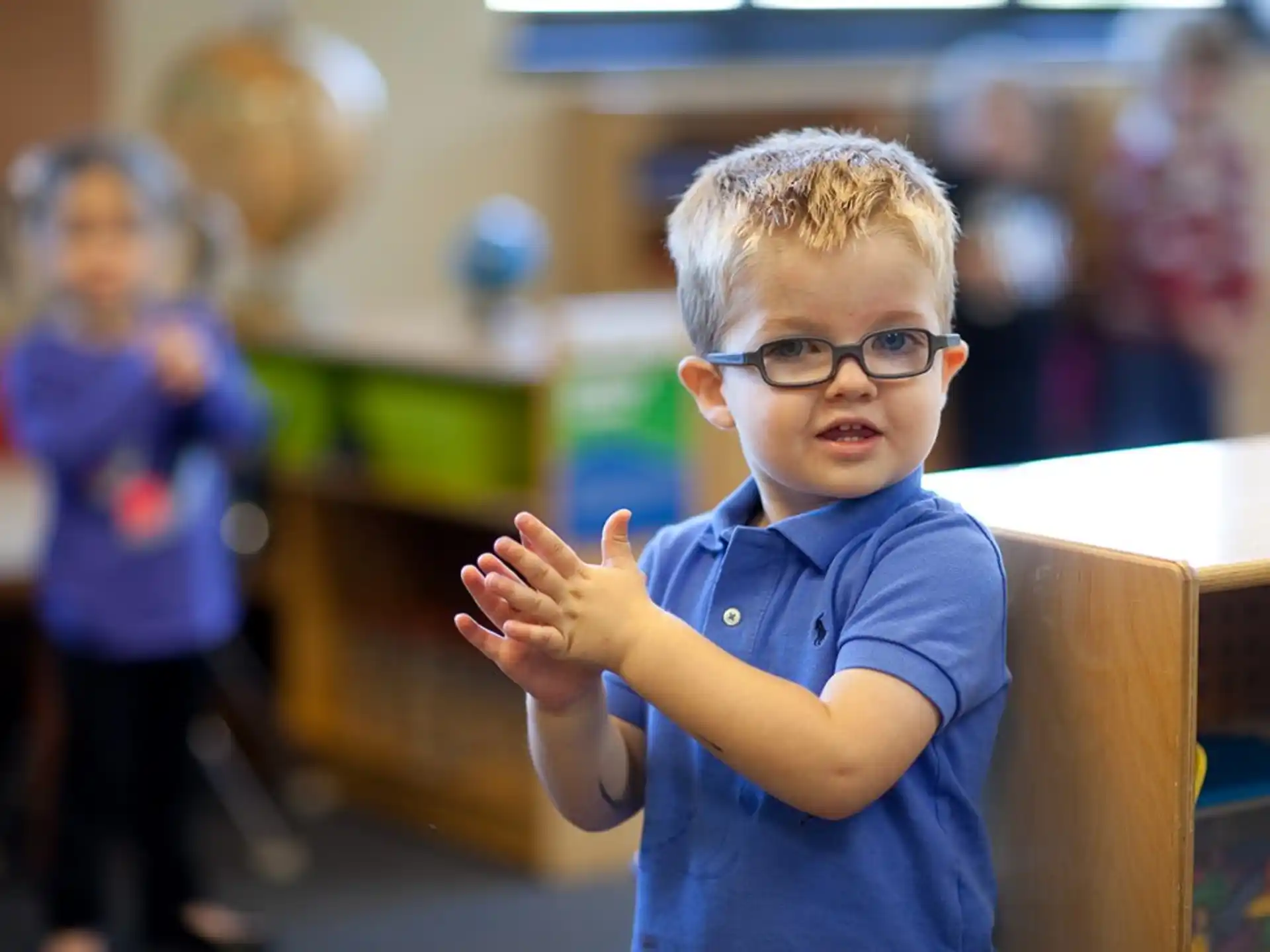 a boy wearing glasses