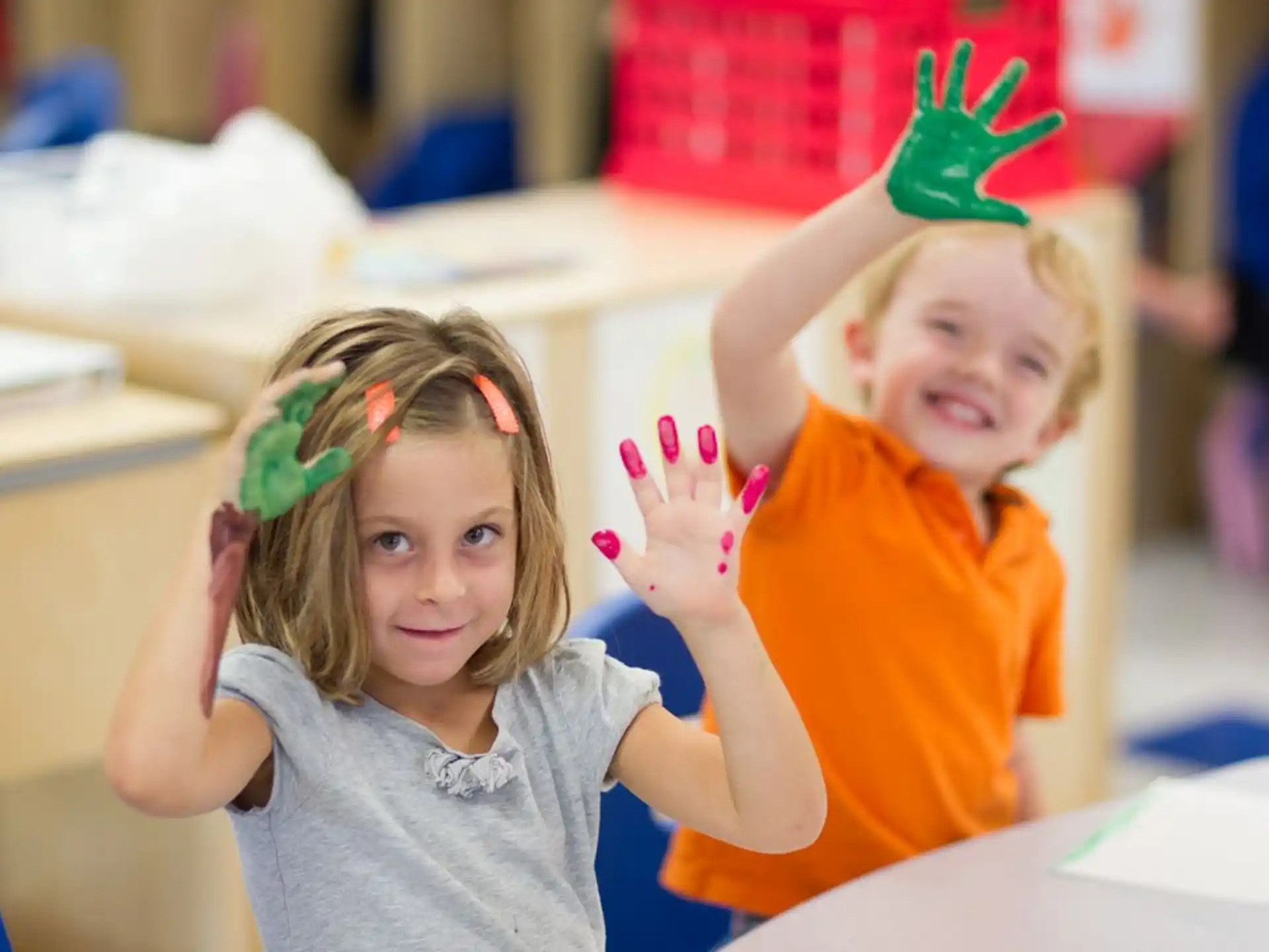 a couple of children wearing party hats