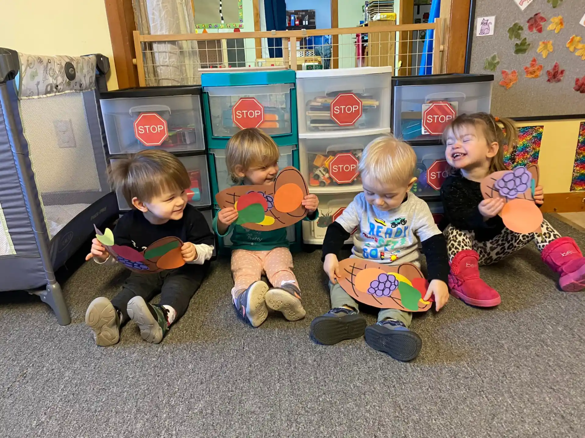 a group of children sitting on the floor