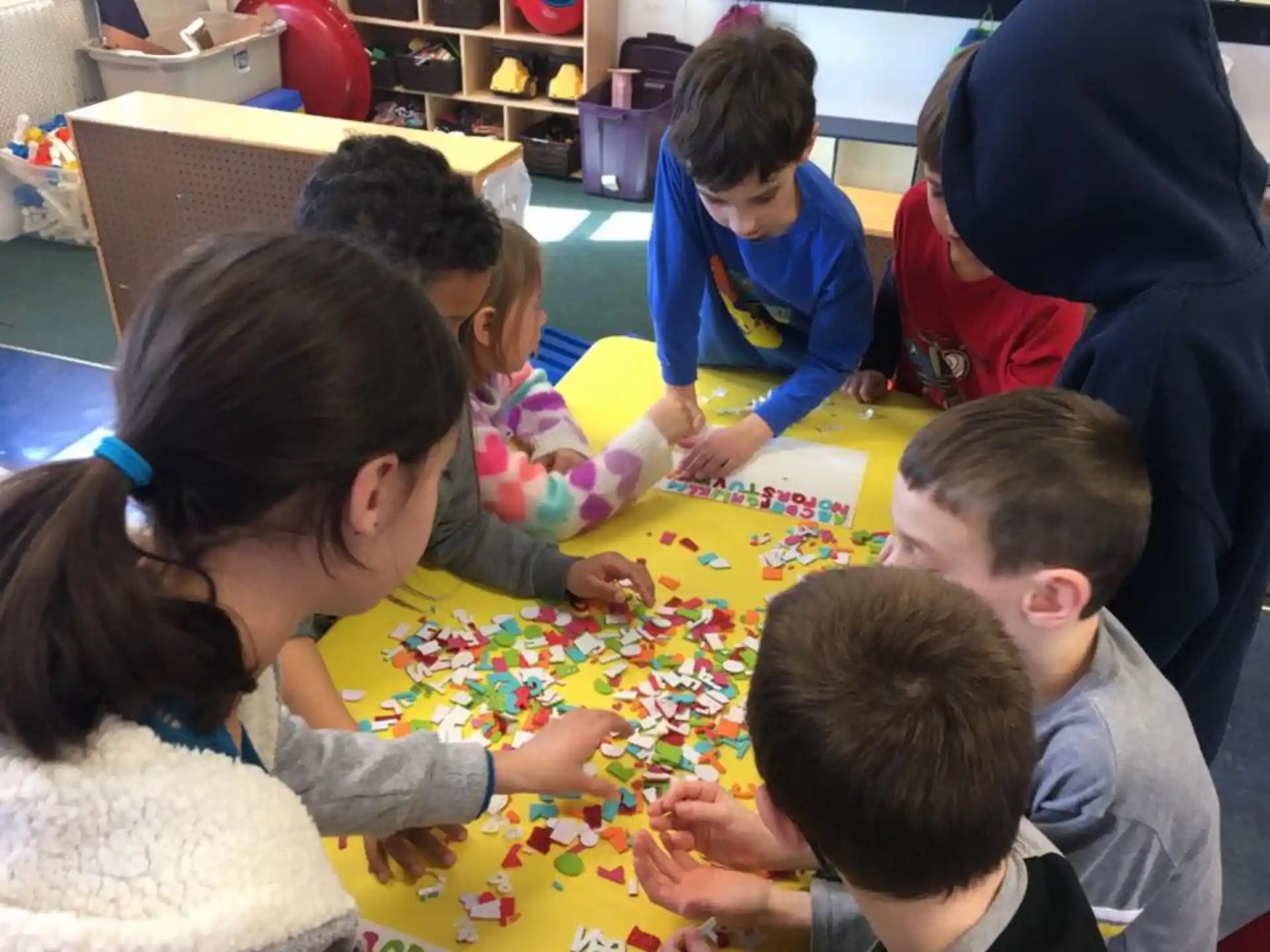 a group of children playing a board game