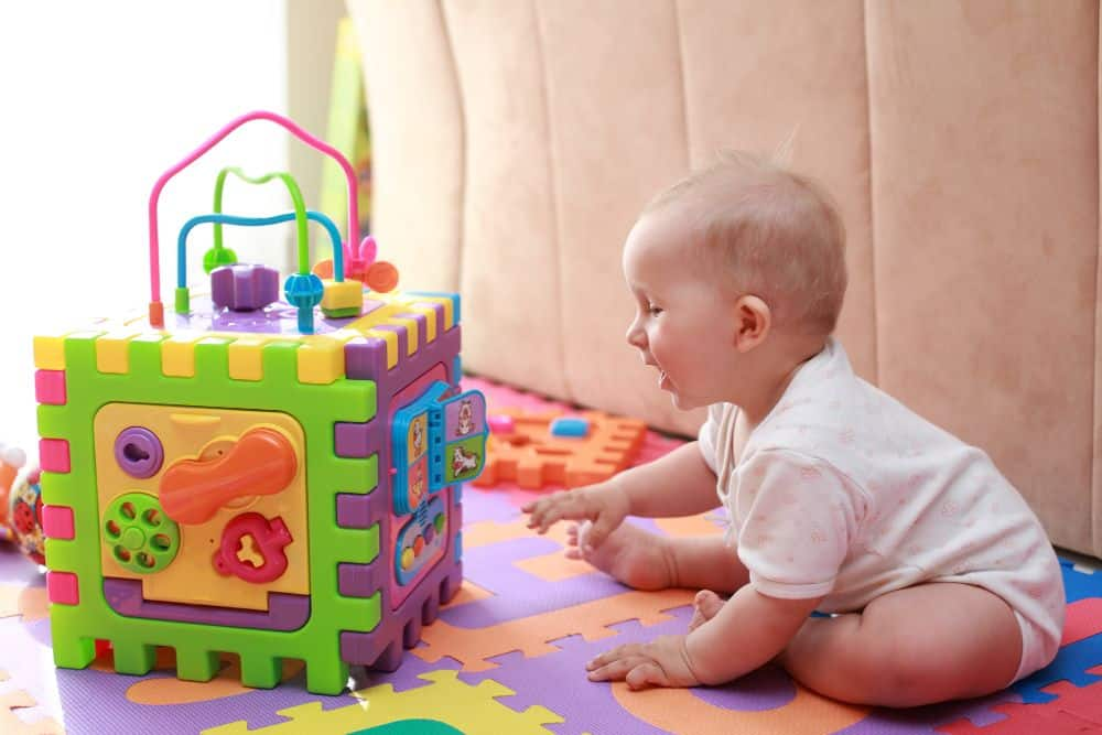 a baby playing with a toy