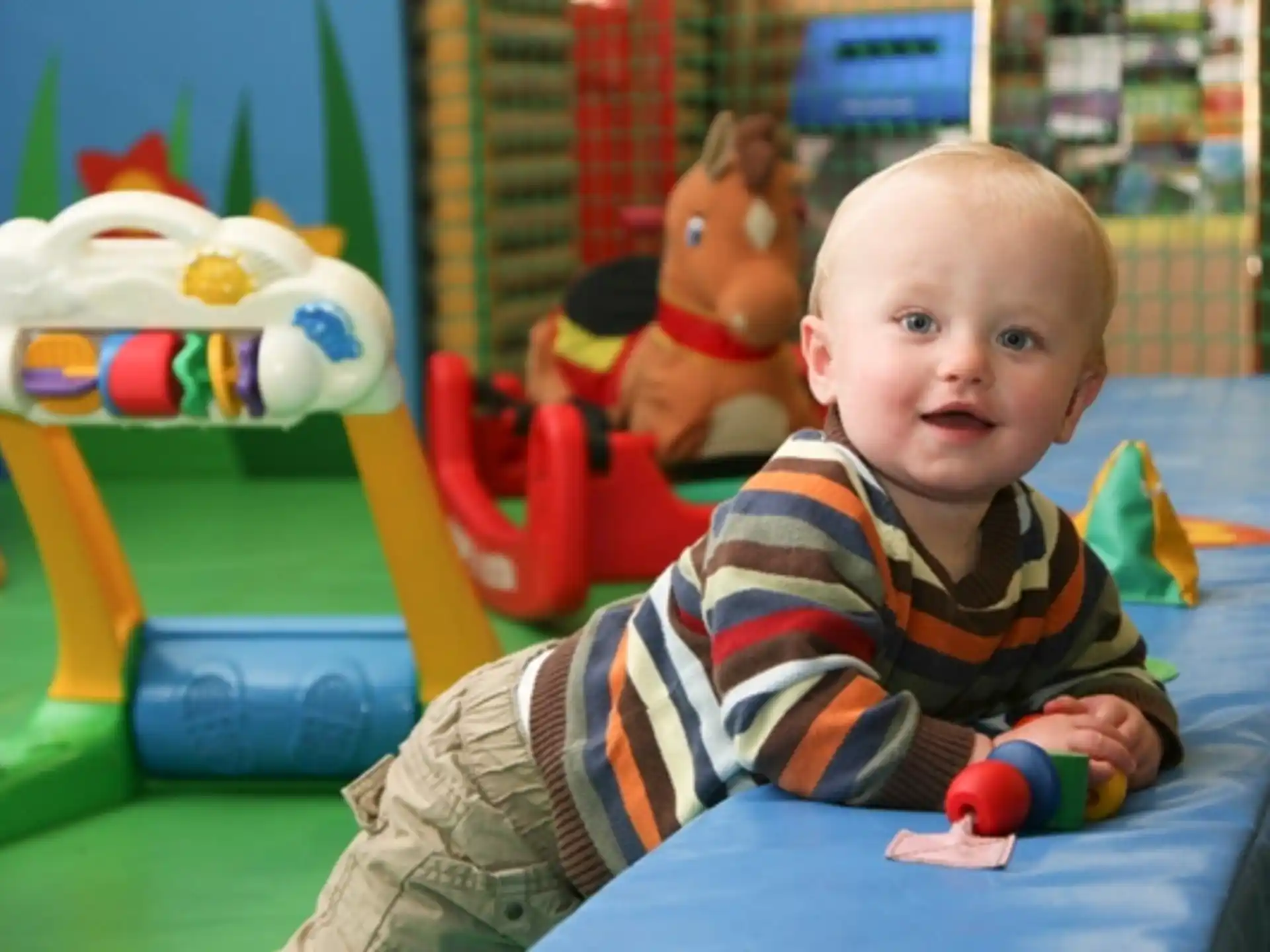 a baby sitting on a chair