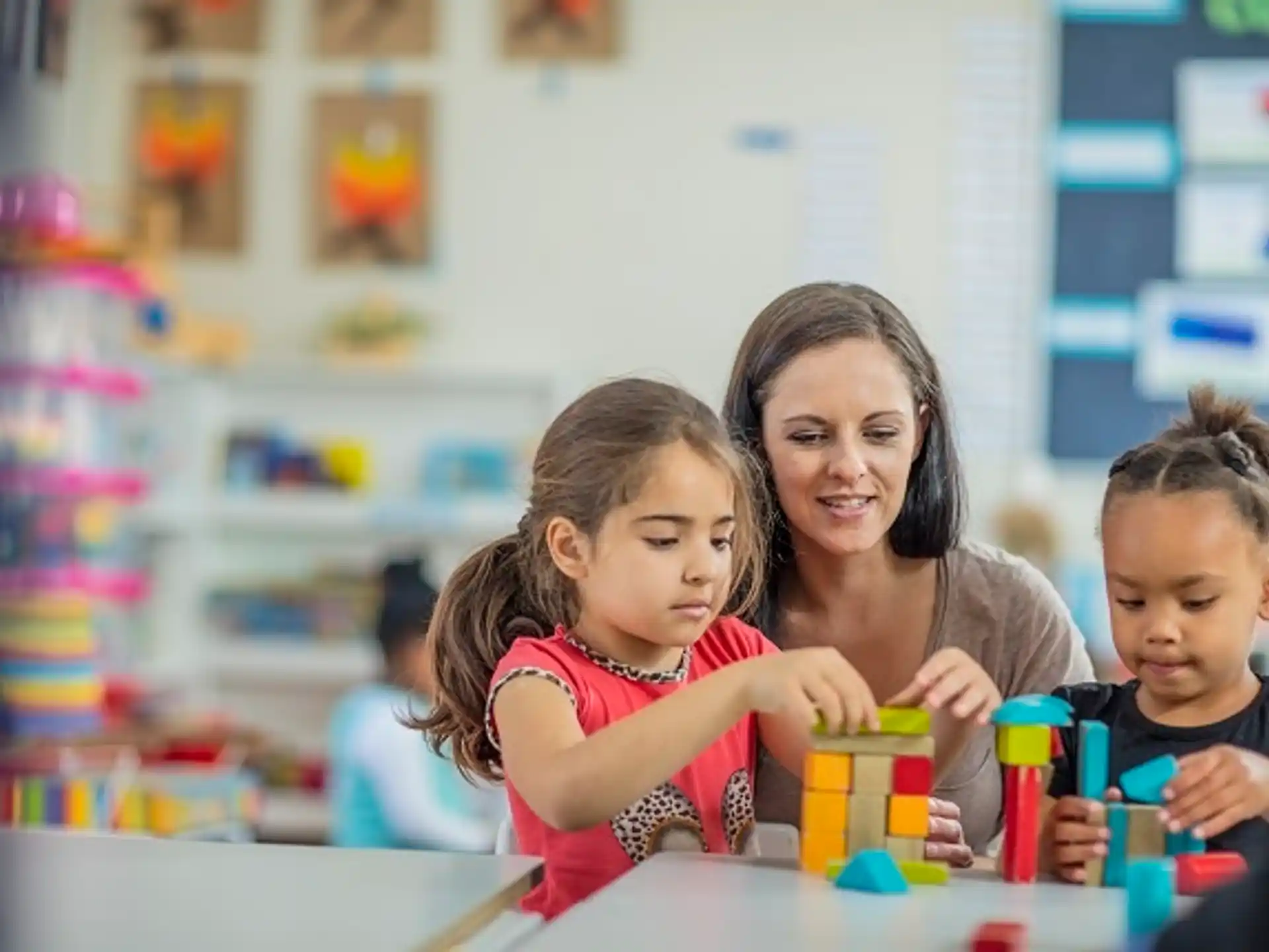 a person and children playing with toys
