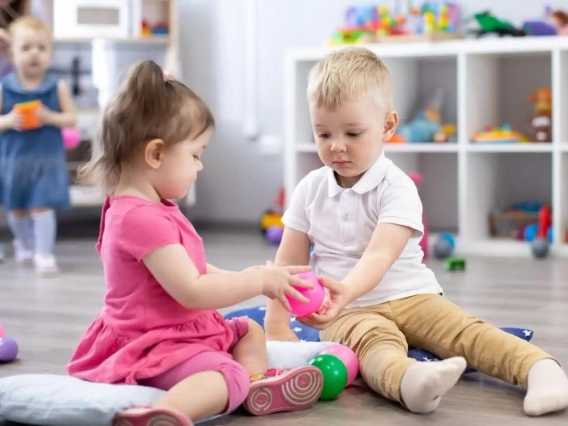 a couple of children playing with toys