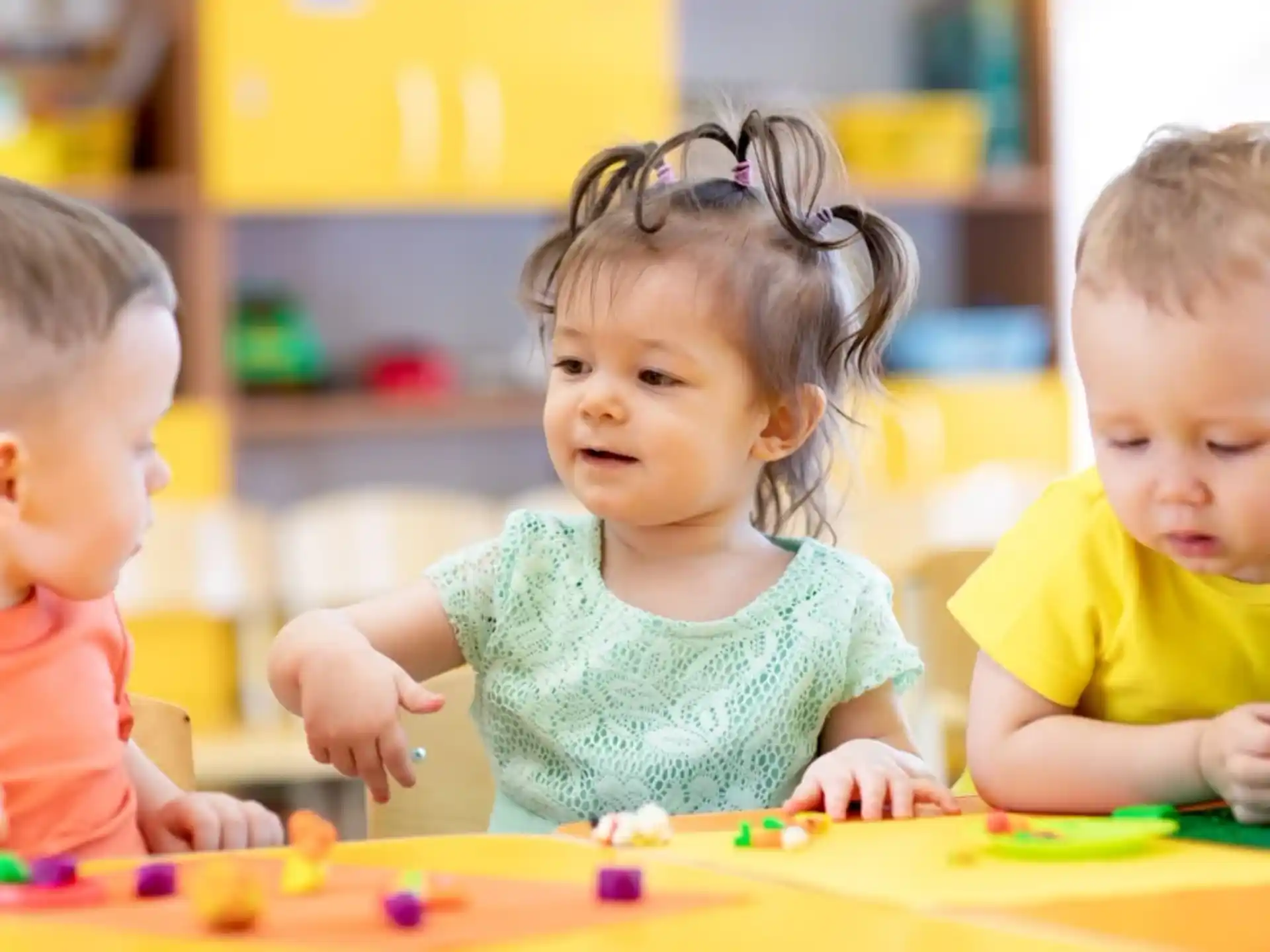 a group of children playing with toys