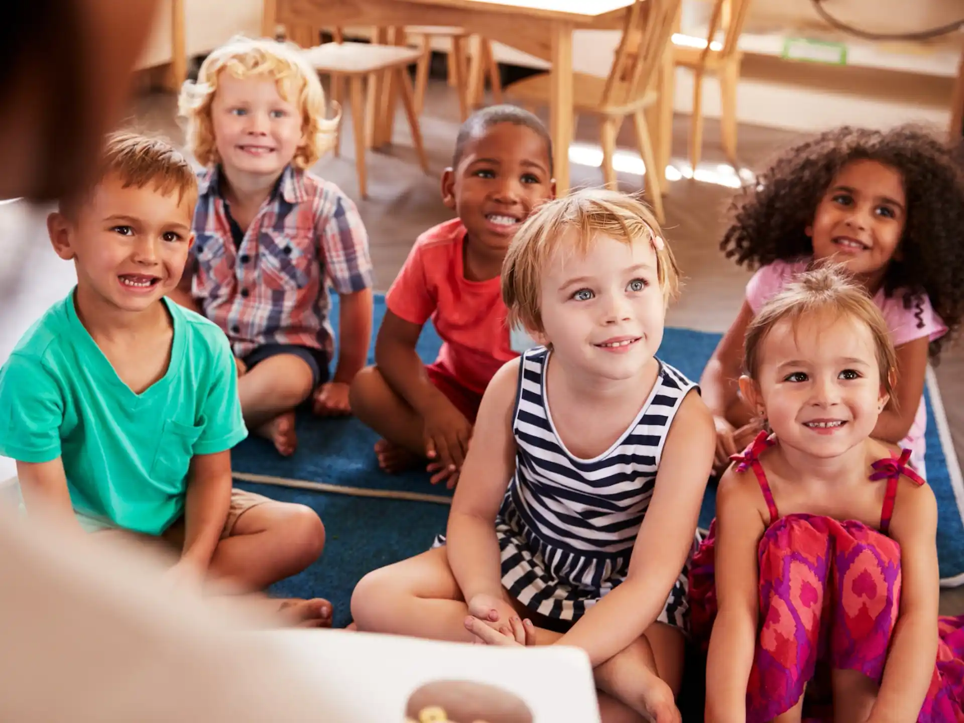 a group of children sitting on the floor