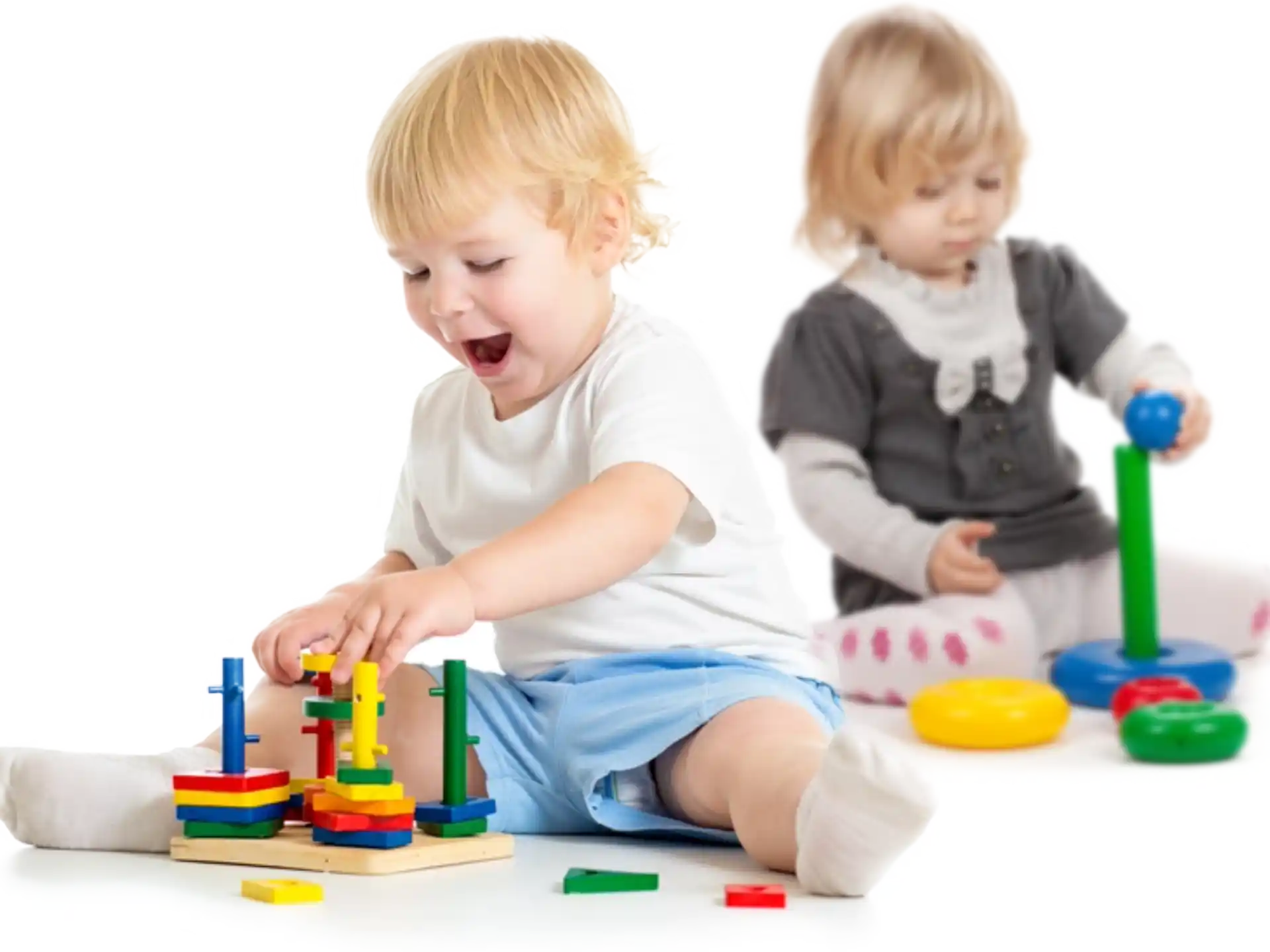a couple of kids playing with toys