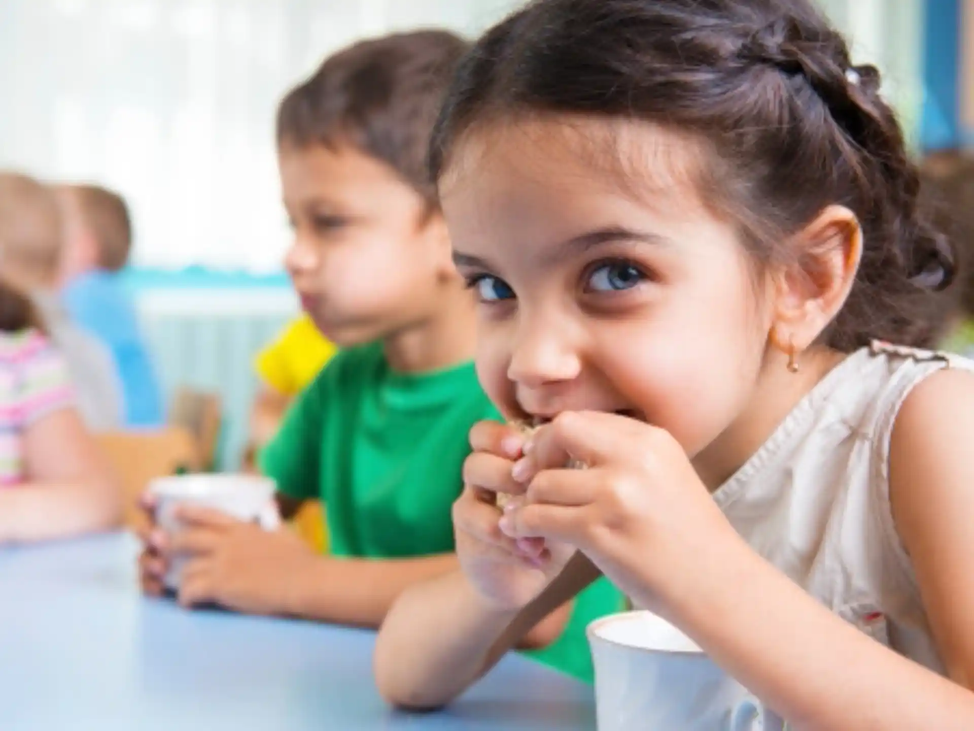 a young girl eating food