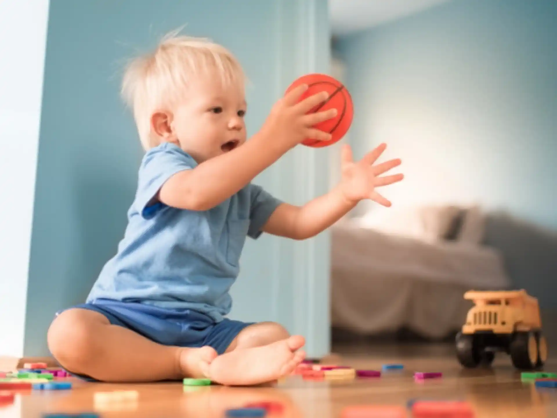 a baby playing with a toy