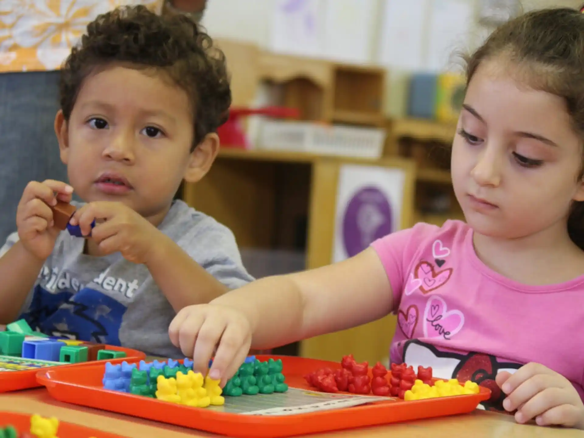 a few young children playing with toys