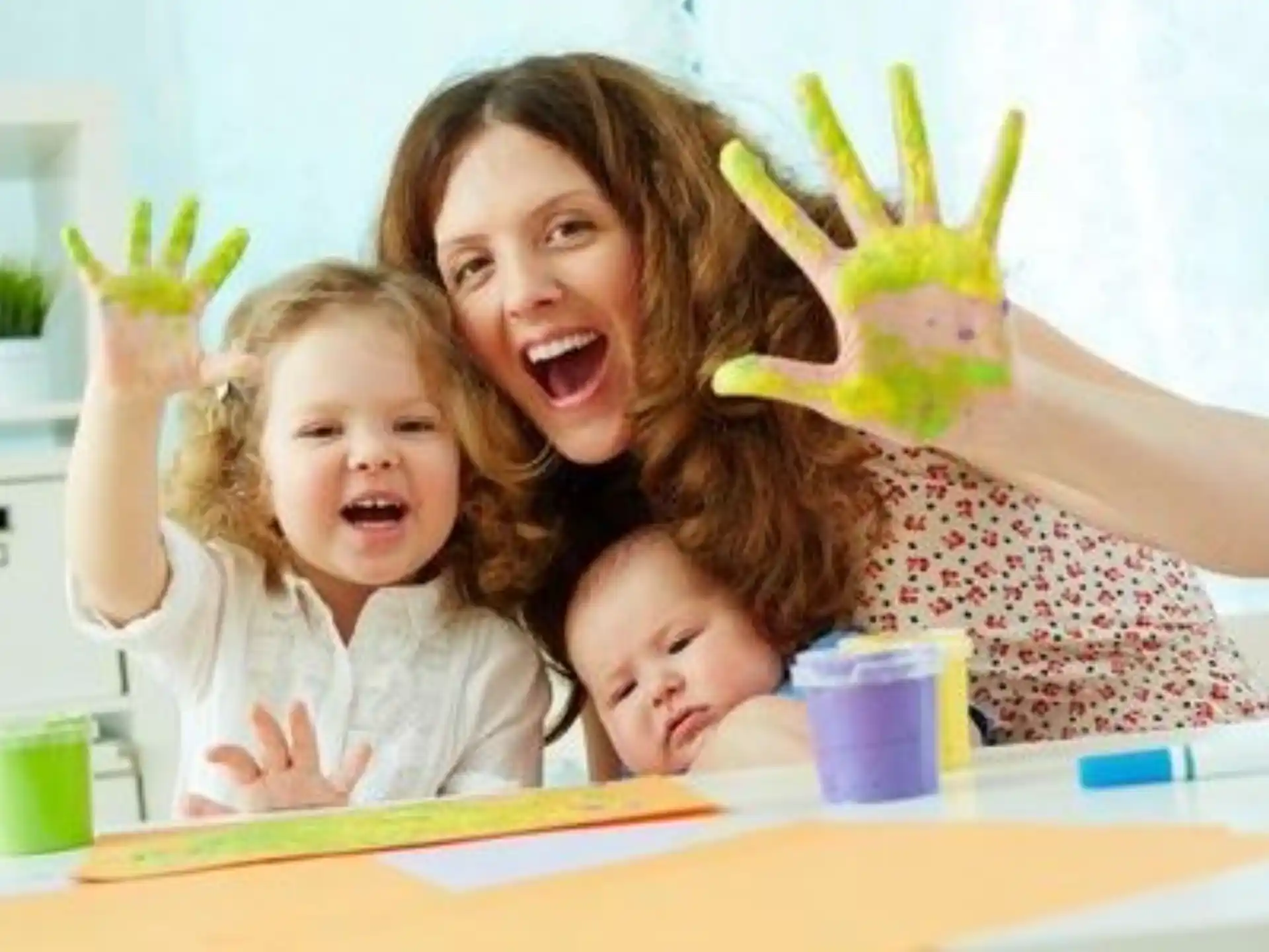 a person and a child with their hands up