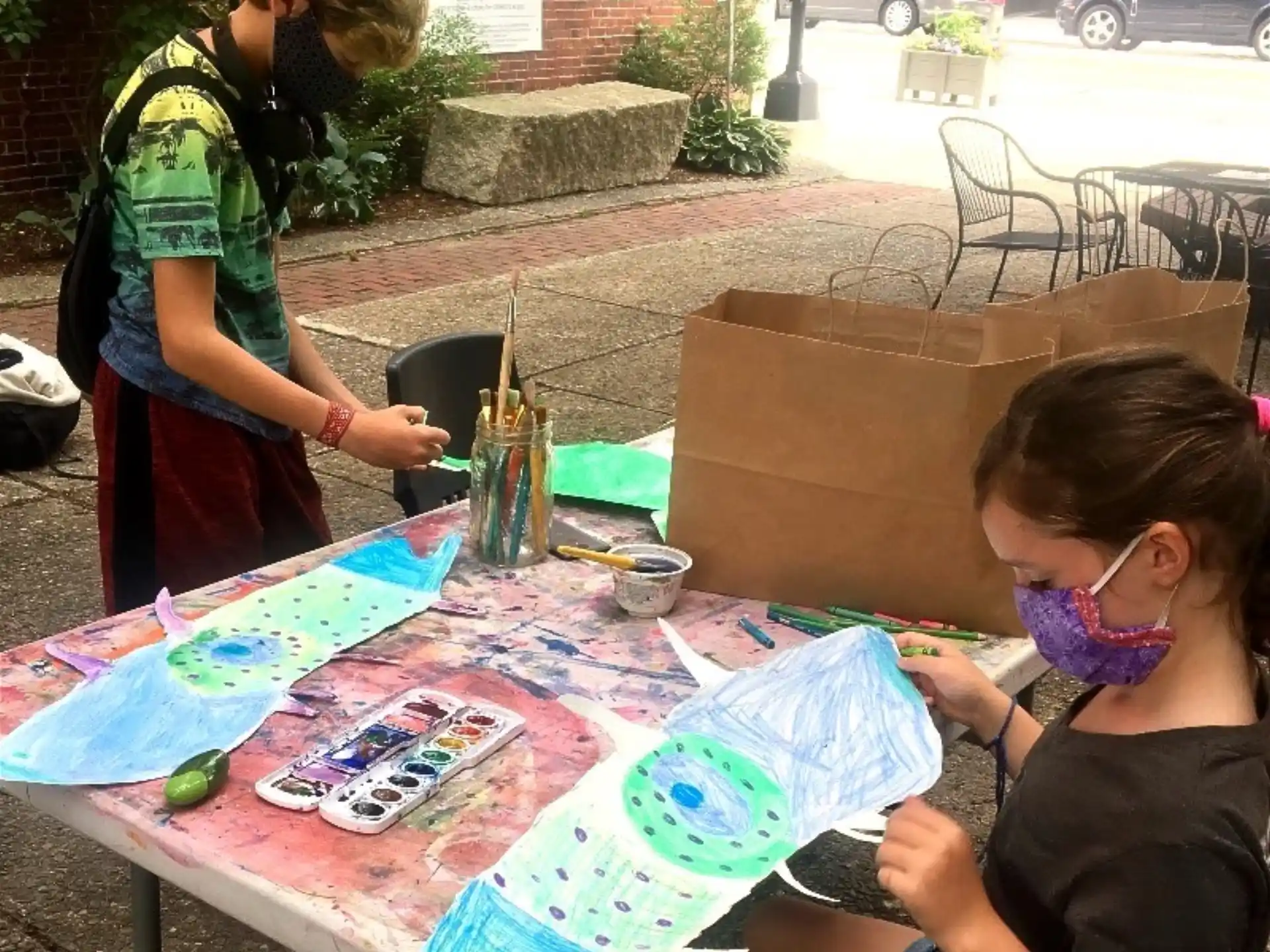 a girl painting on a table