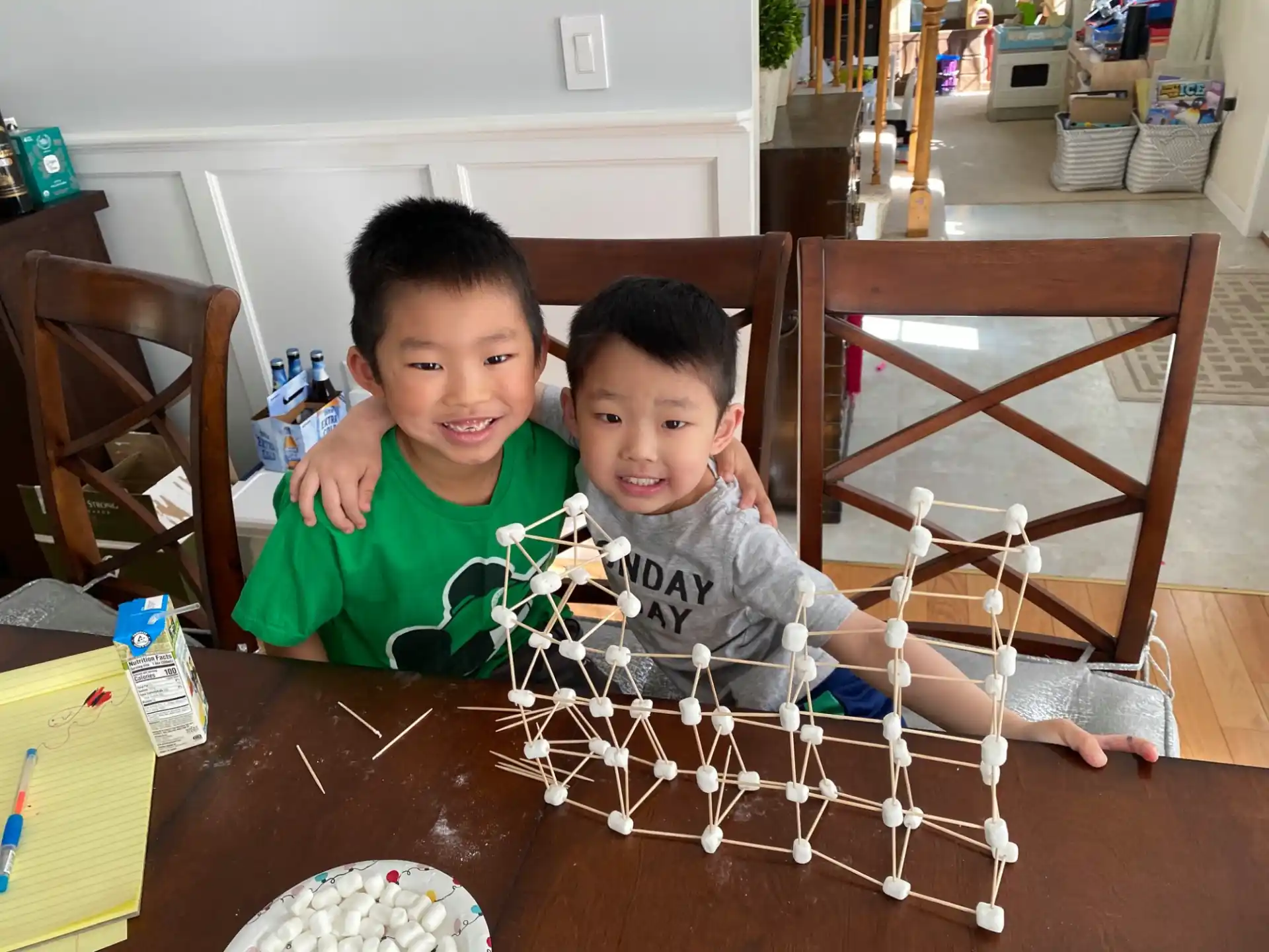 two boys sitting at a table