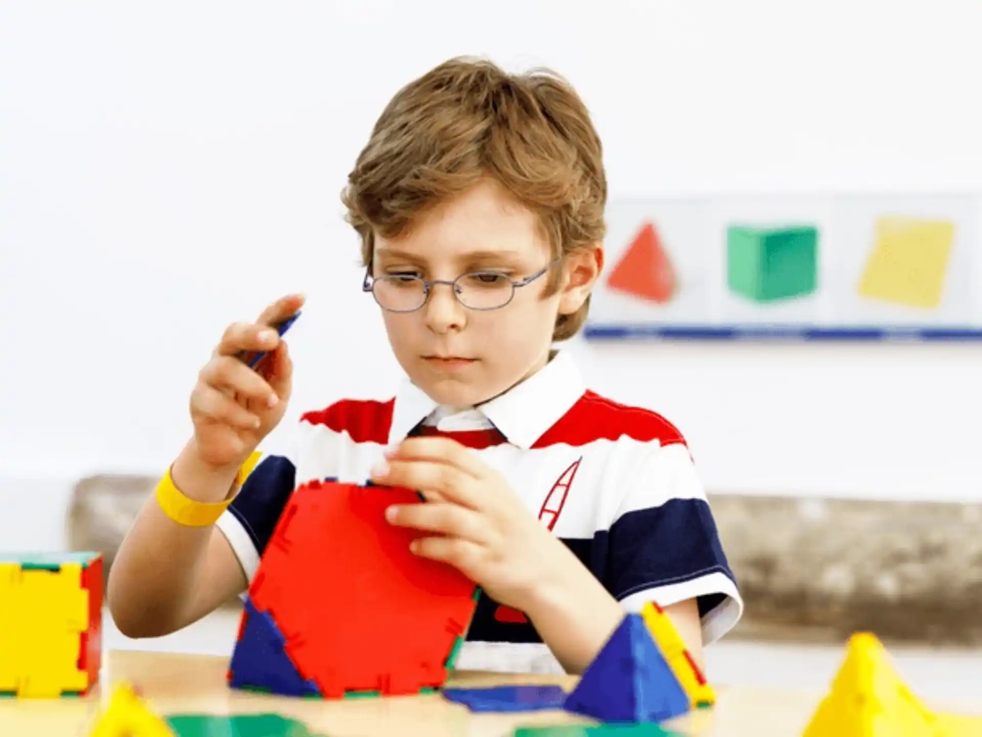 a boy sitting at a table