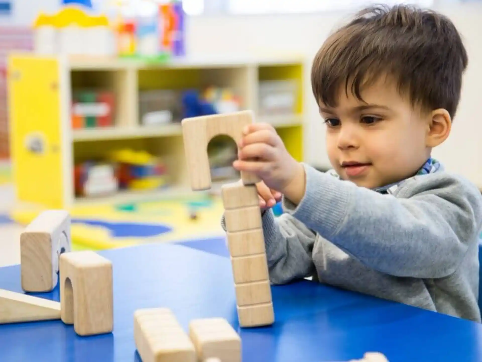 a child playing with building blocks
