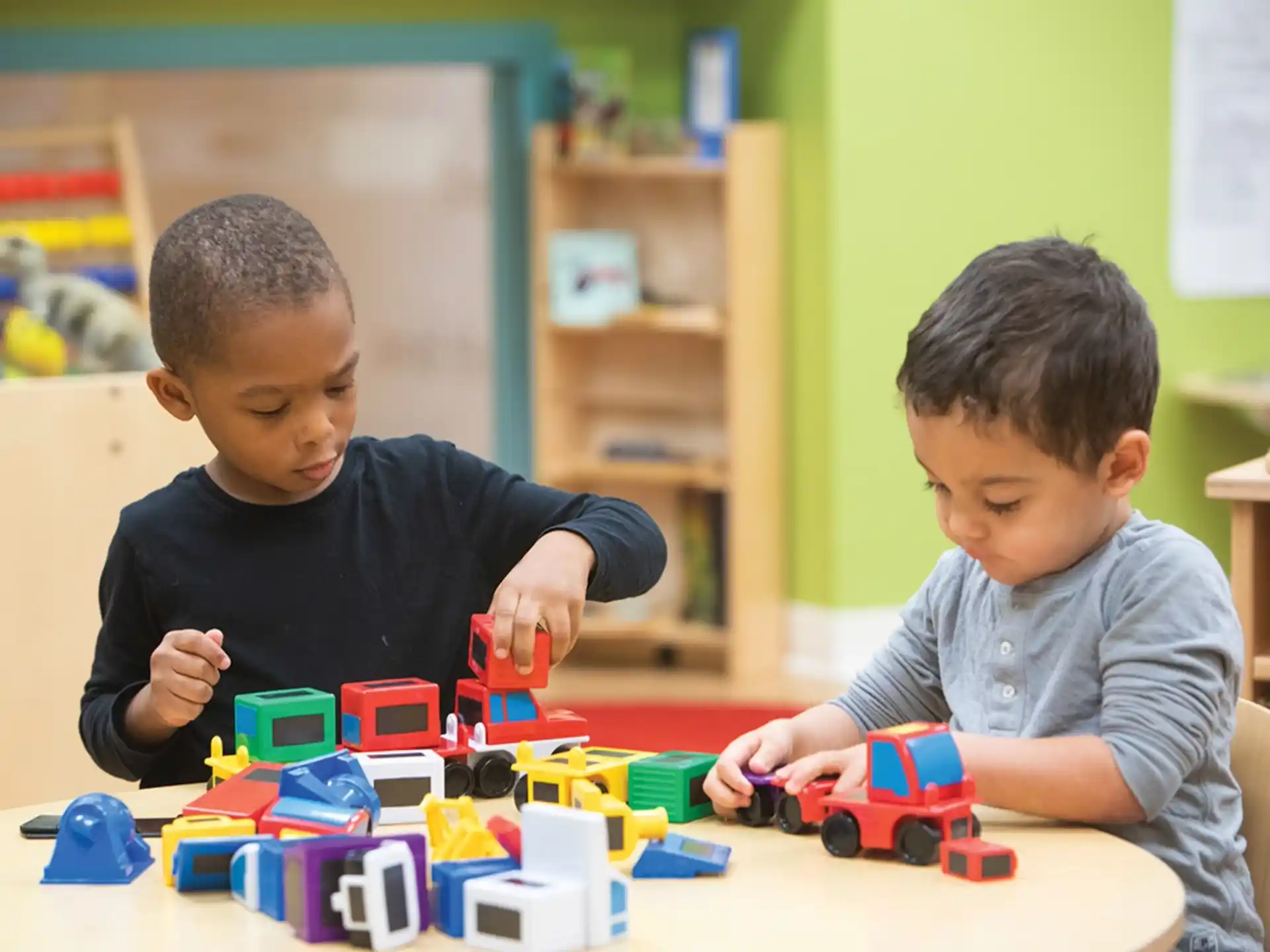 a couple of boys playing with toys