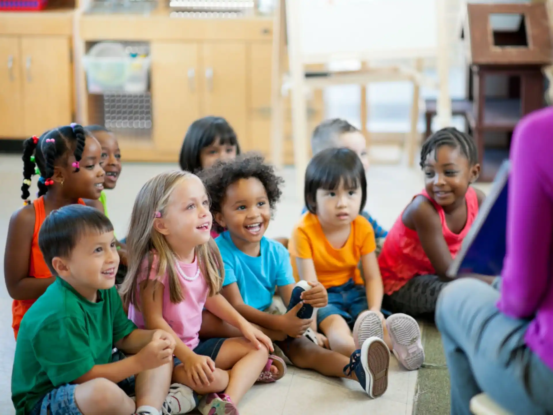 a group of children sitting on the floor