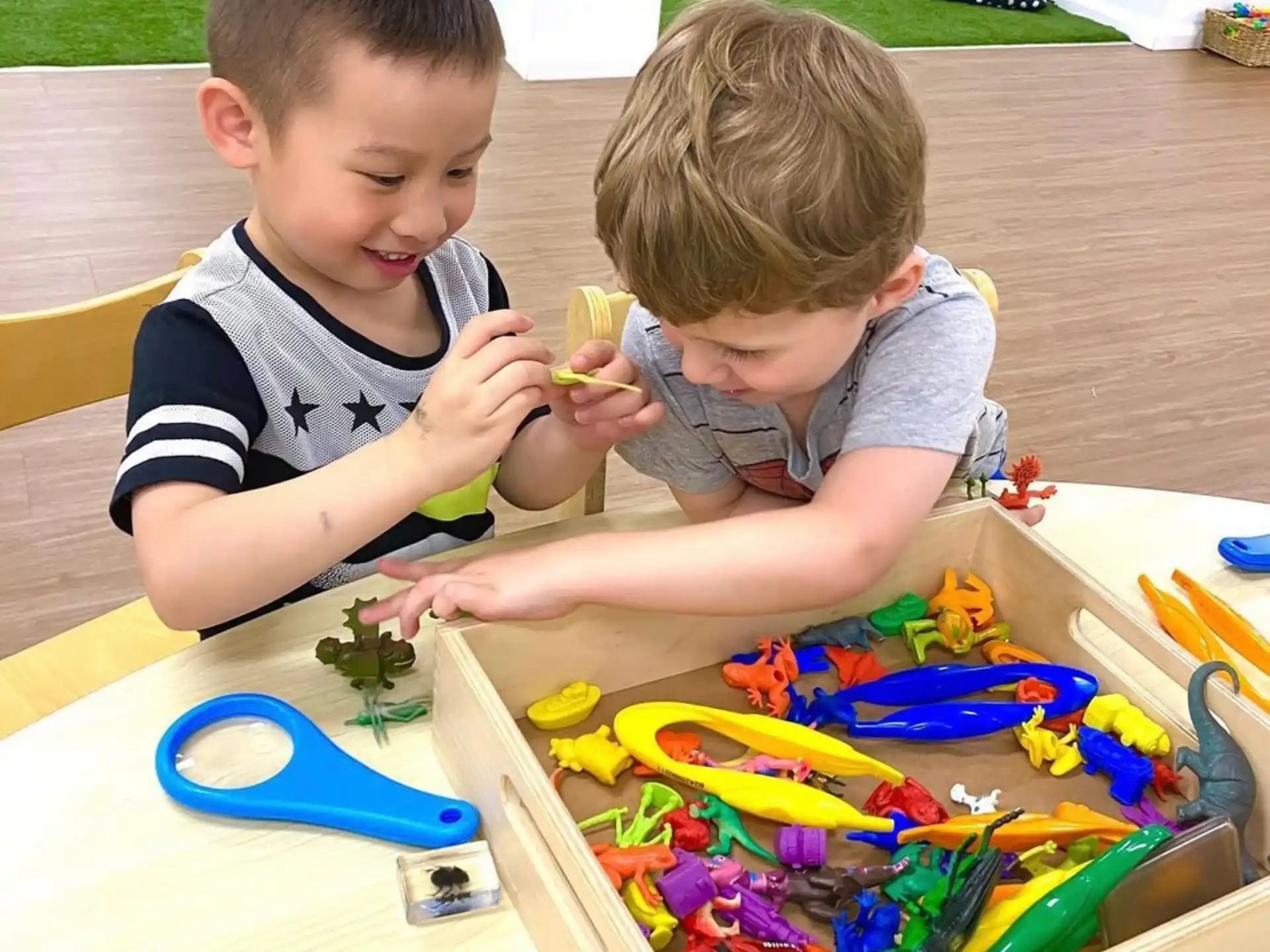 two boys sitting at a table