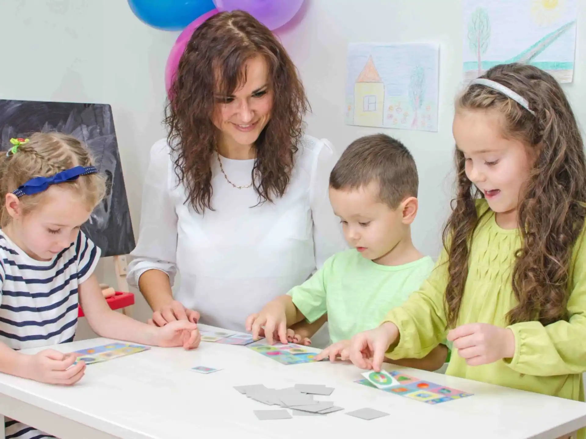 a group of children sitting at a table