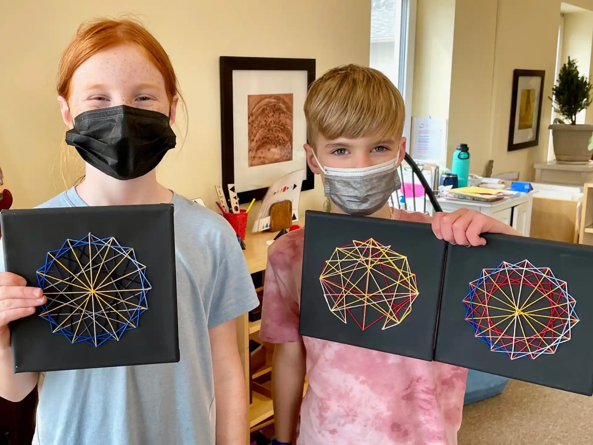 a couple of boys wearing masks