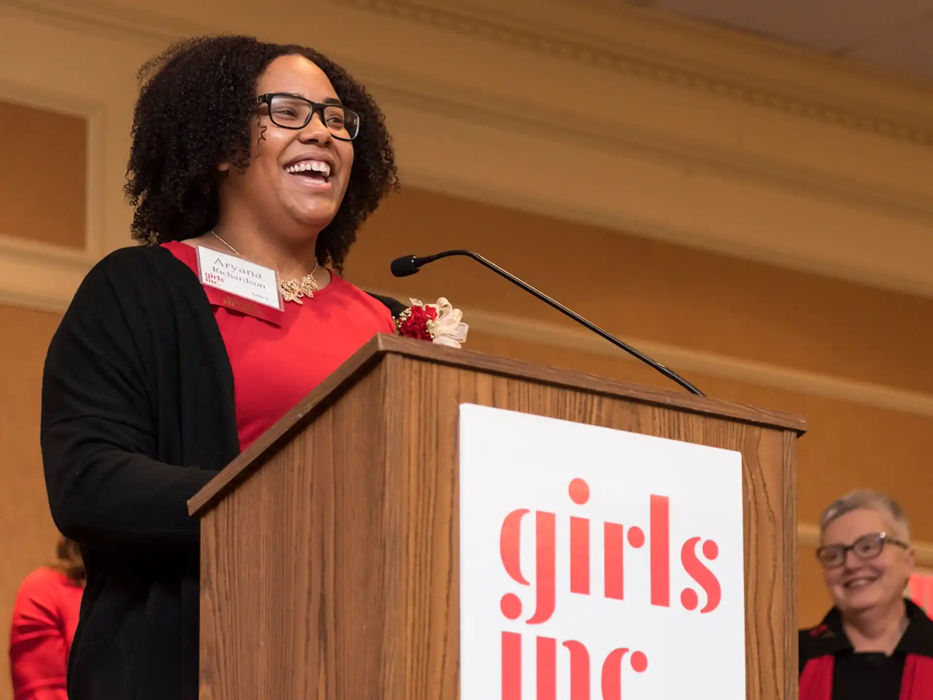 a person standing at a podium