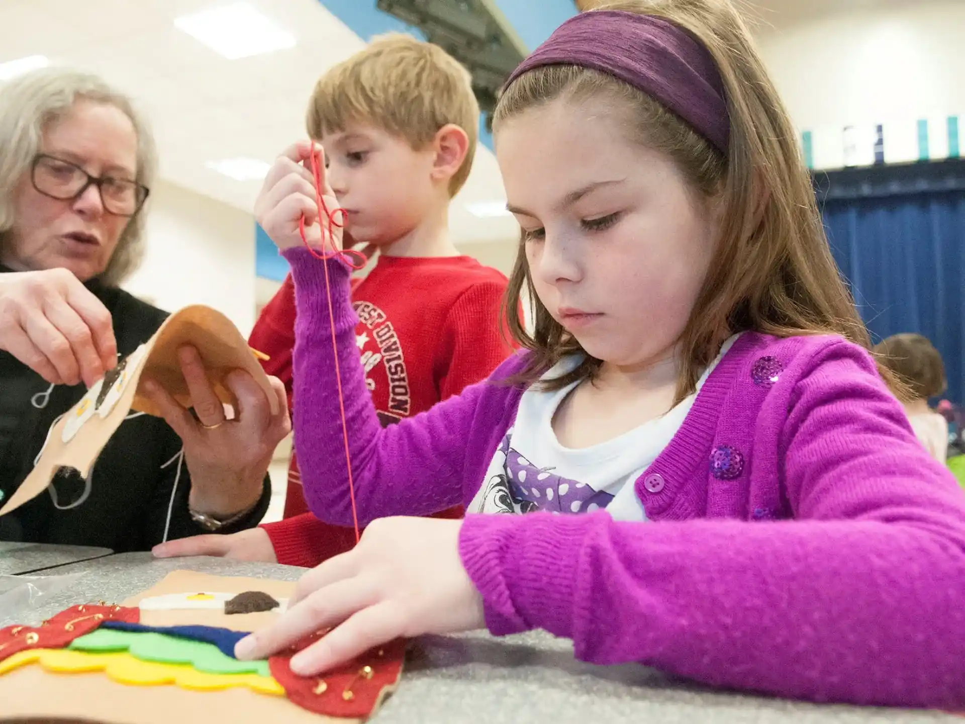 a woman and a child painting