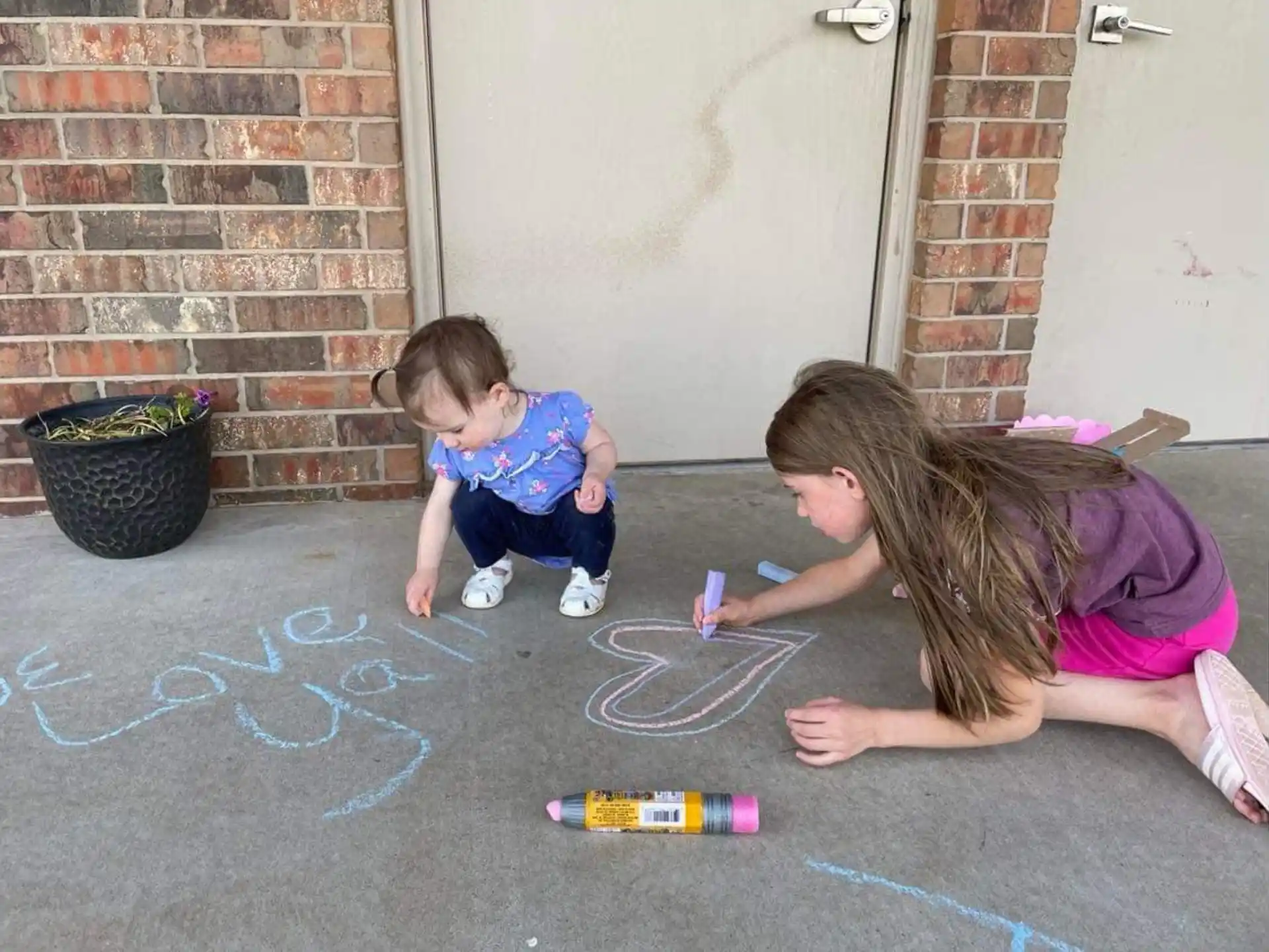 a person and a child playing with a toy