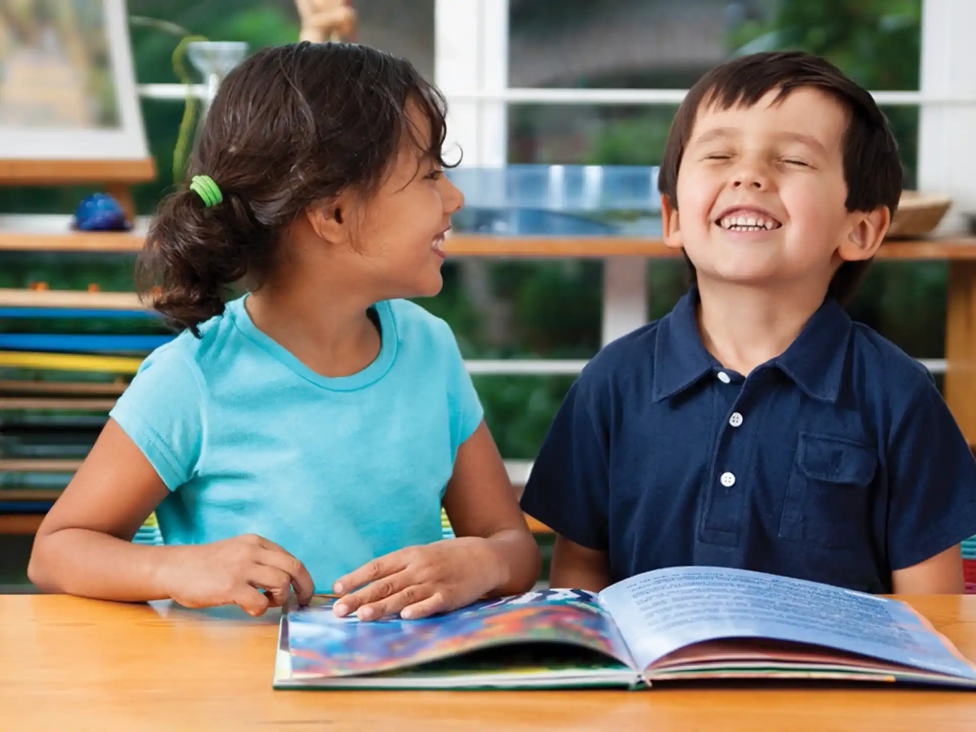 a person and a boy reading a book