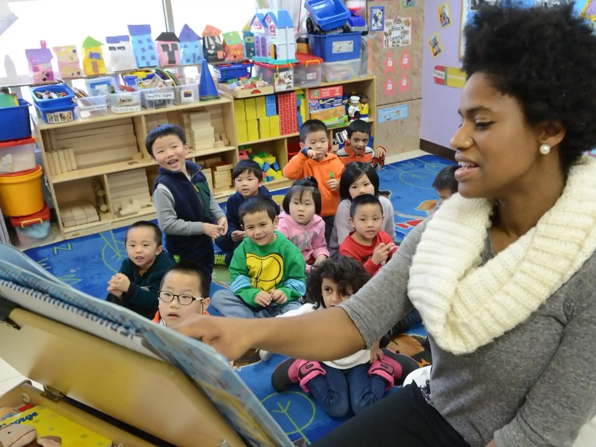 a person teaching a group of children