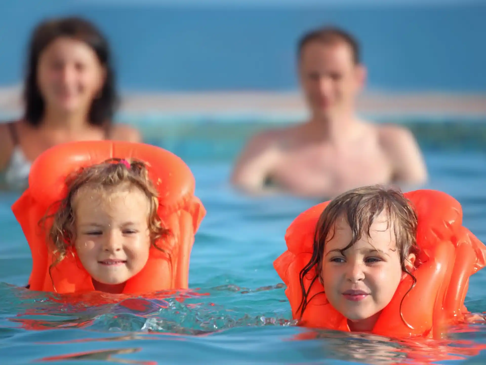 a group of people in a pool