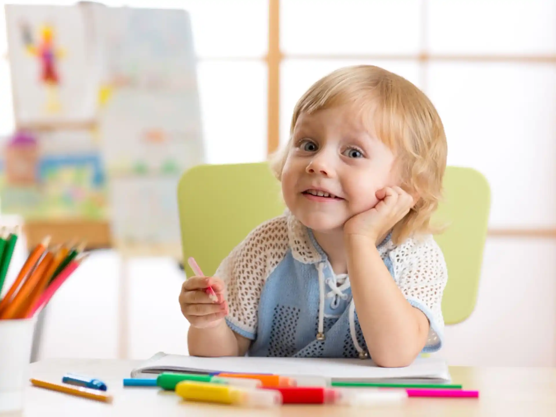 a child sitting at a table