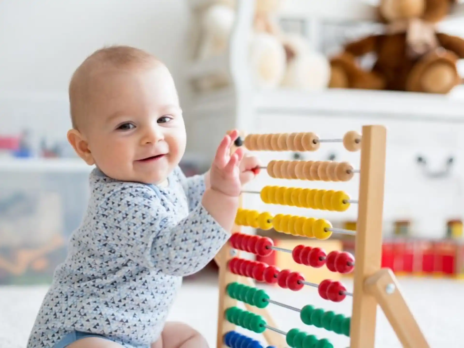a baby holding a toy