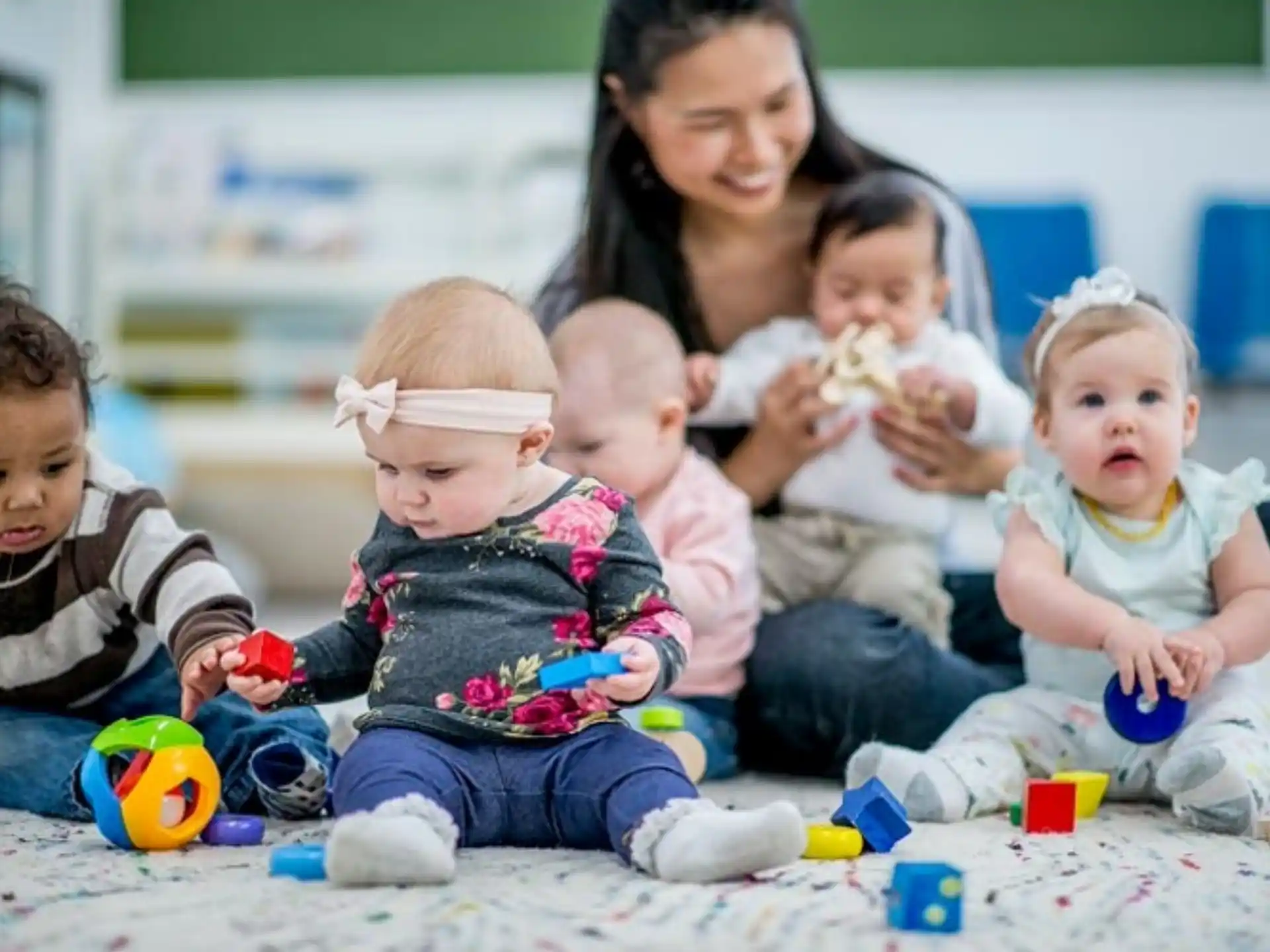 a group of children sitting on the floor
