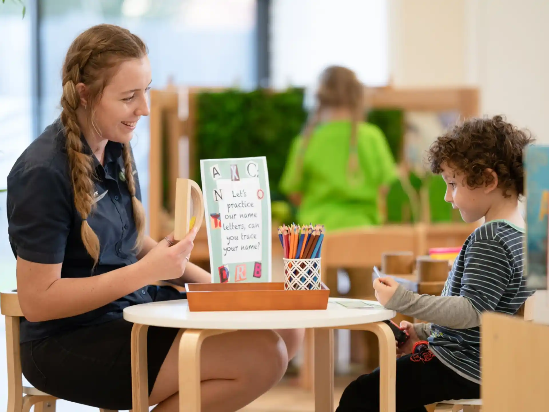 a woman and a child sitting at a table