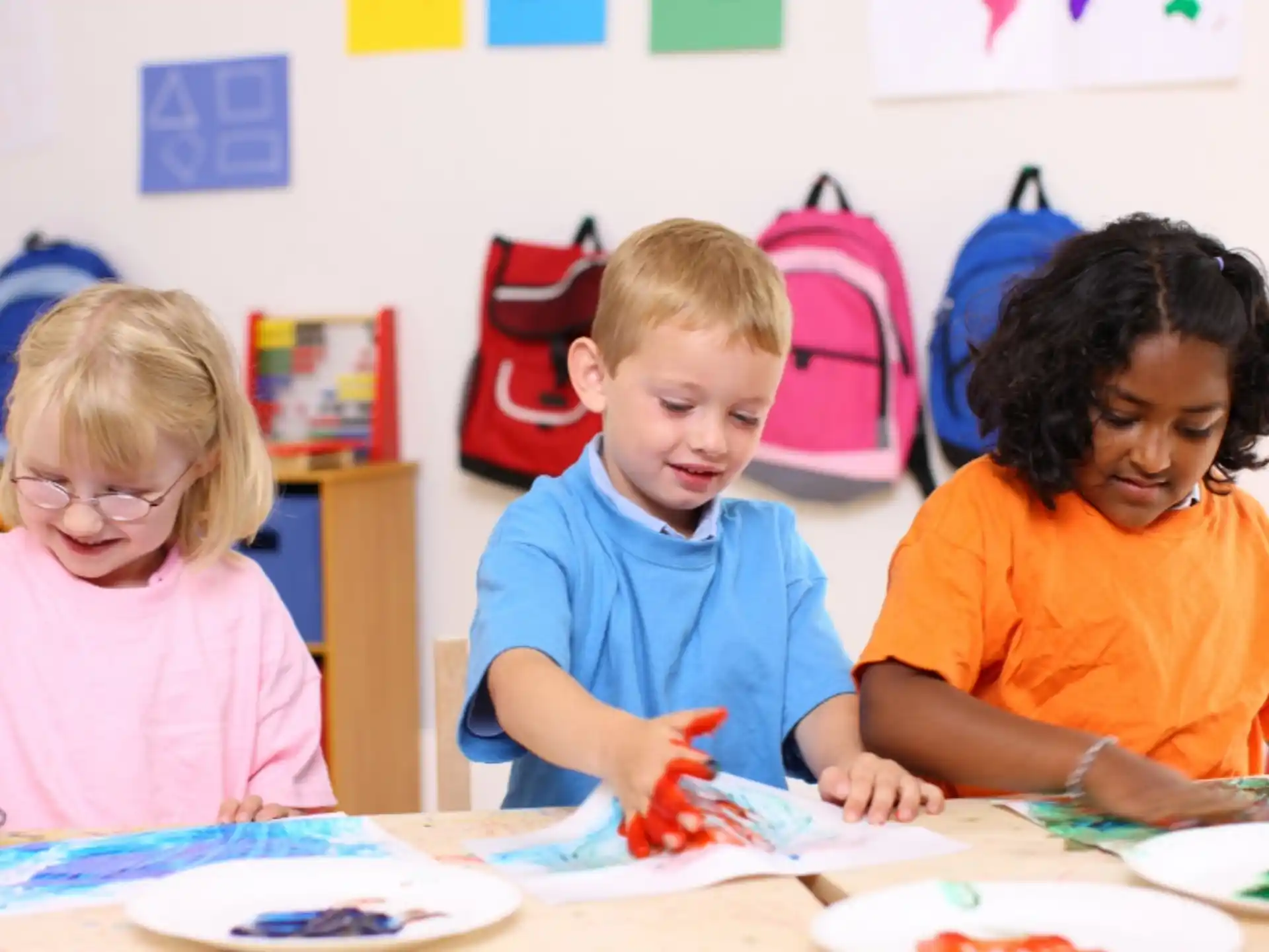 a group of children sitting at a table