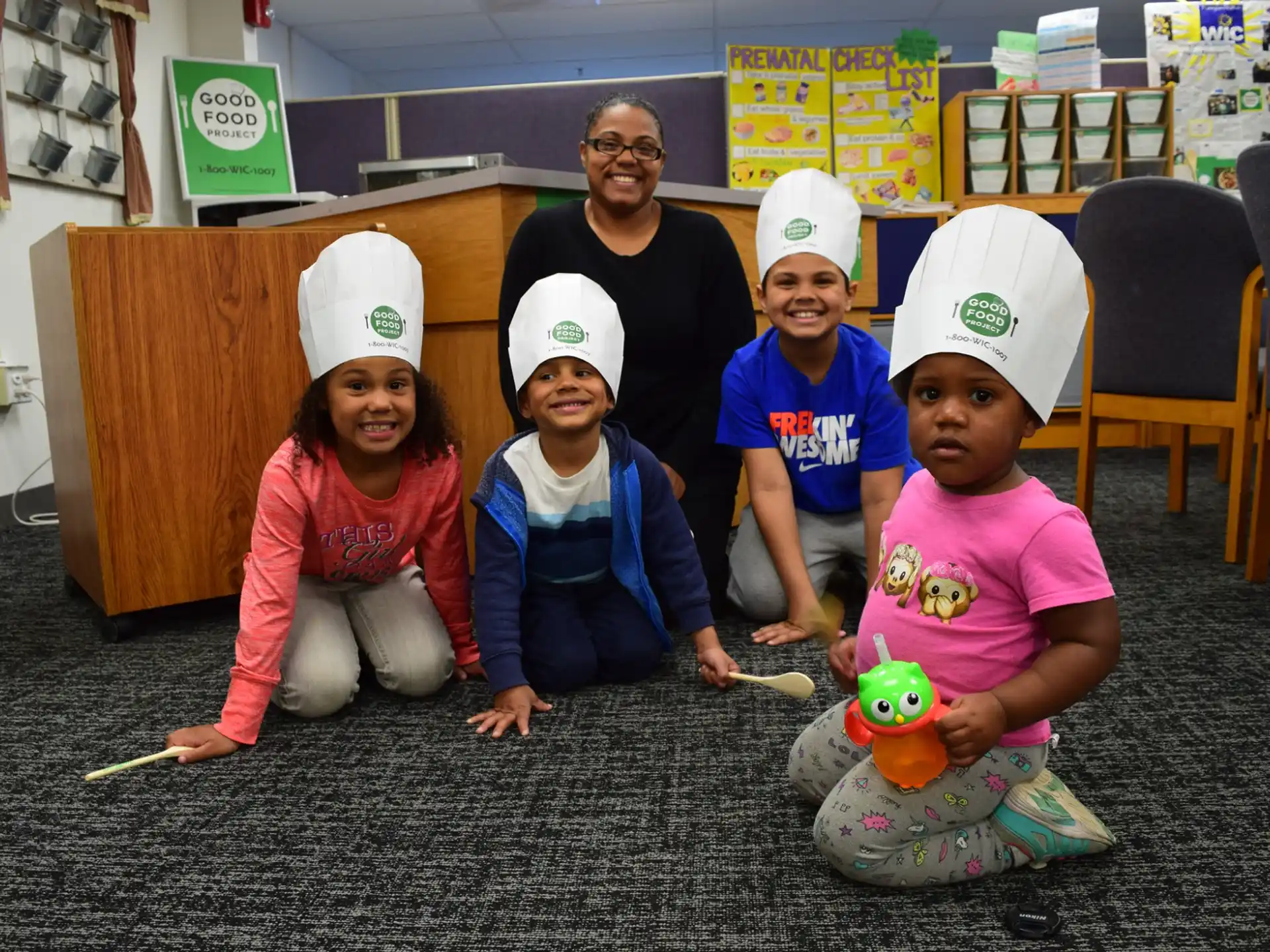 a group of children wearing white hats