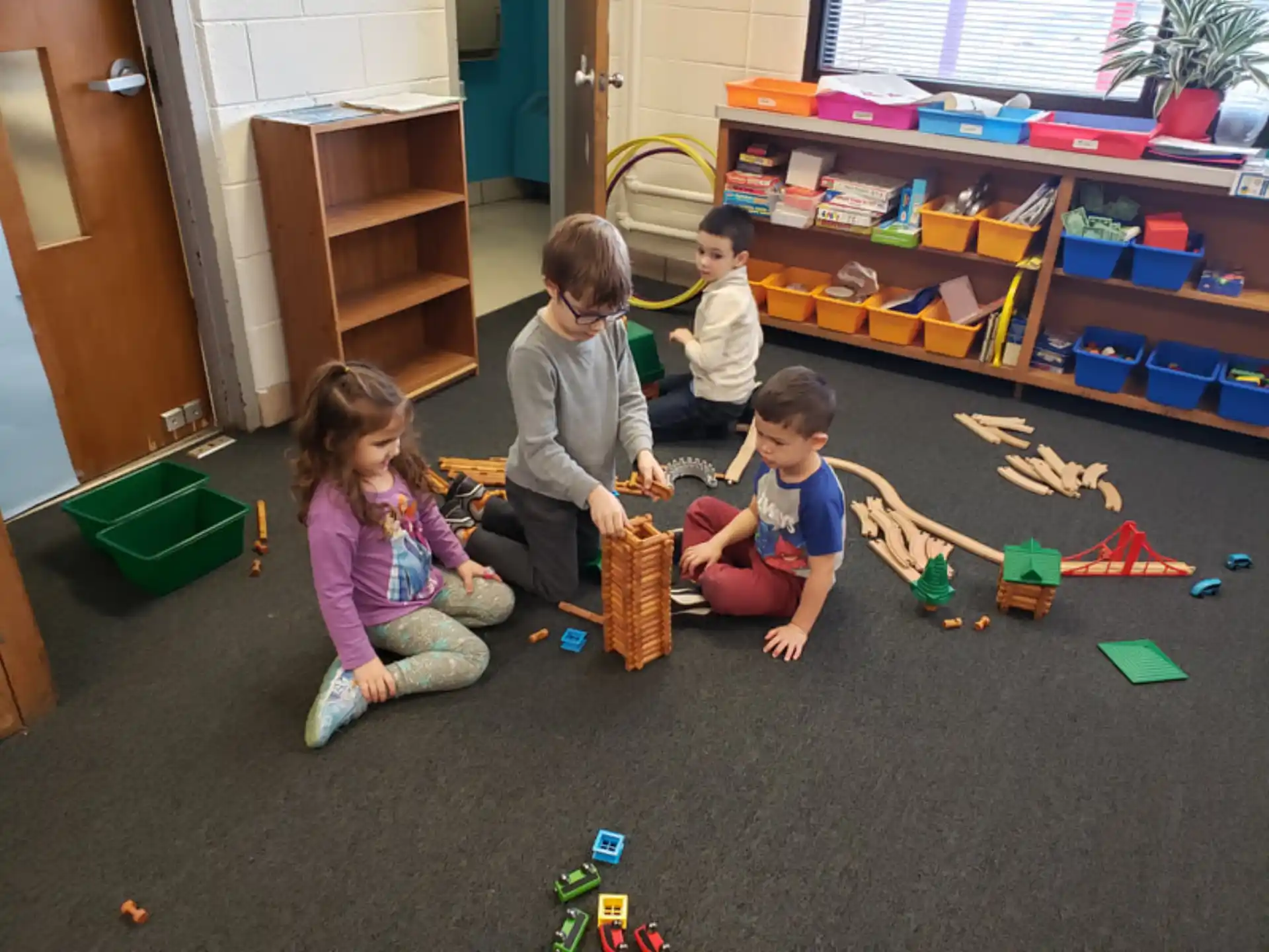 a group of children playing with toys
