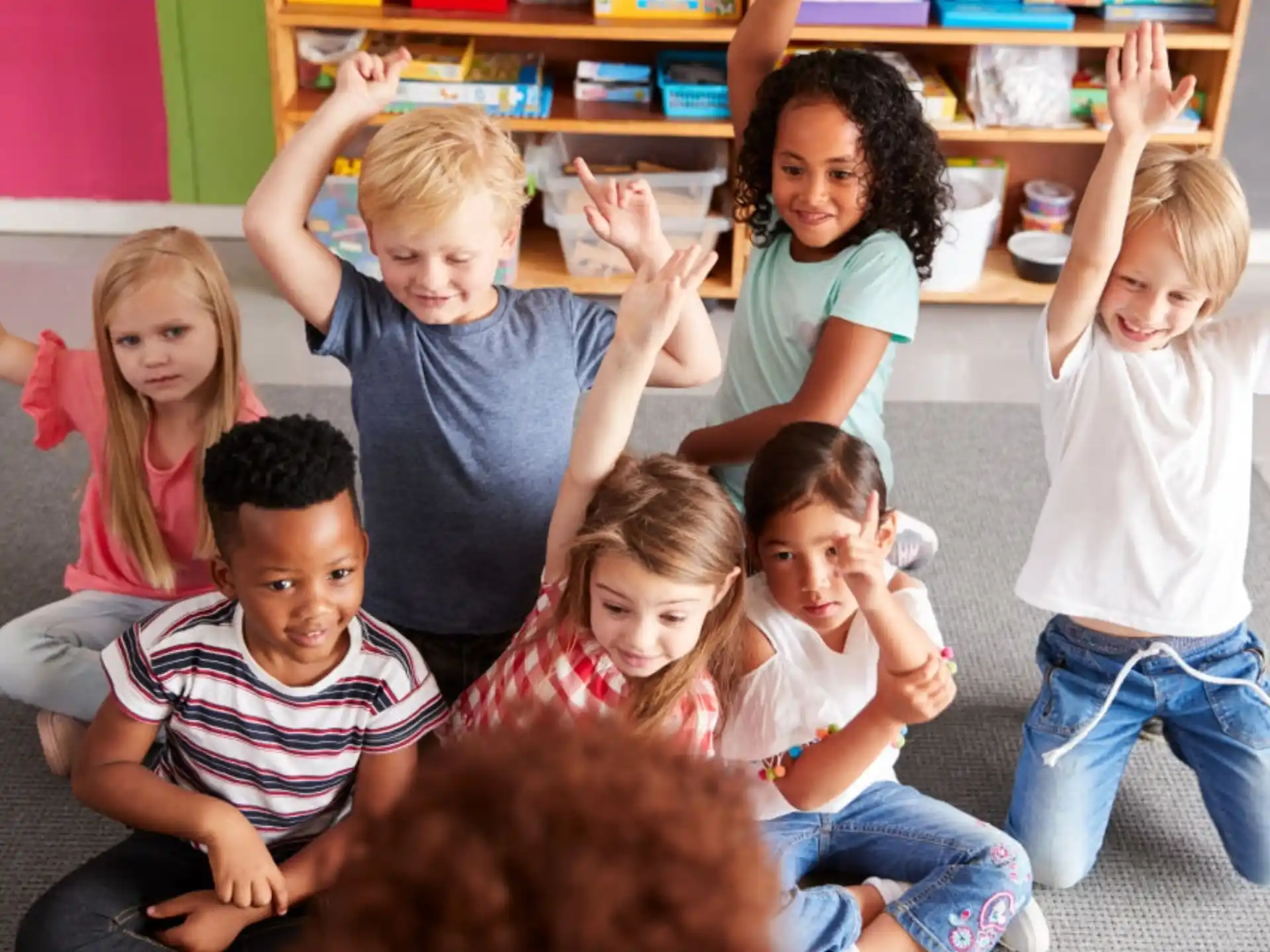 a group of children sitting on the floor