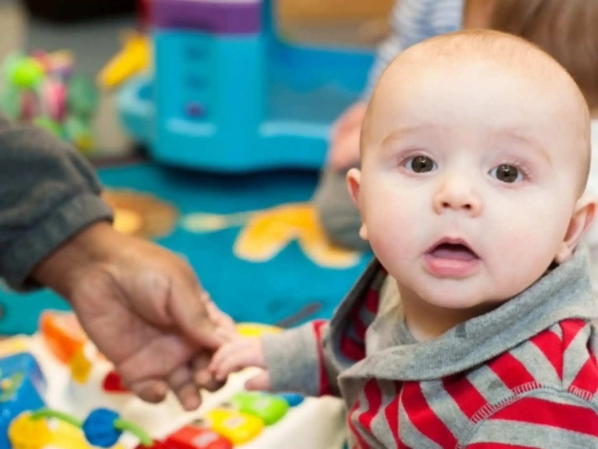 a baby being held by a person