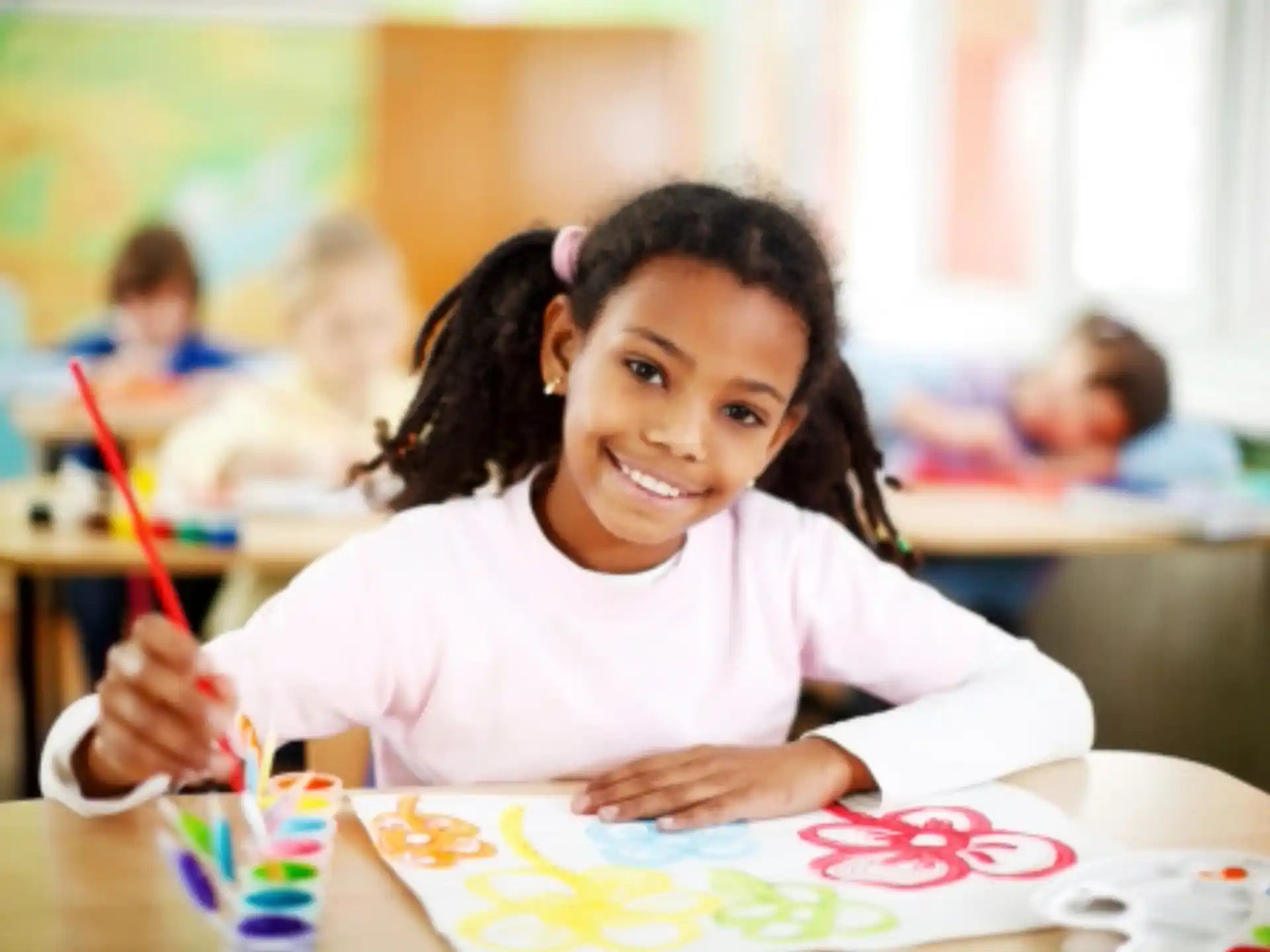 a young girl smiling