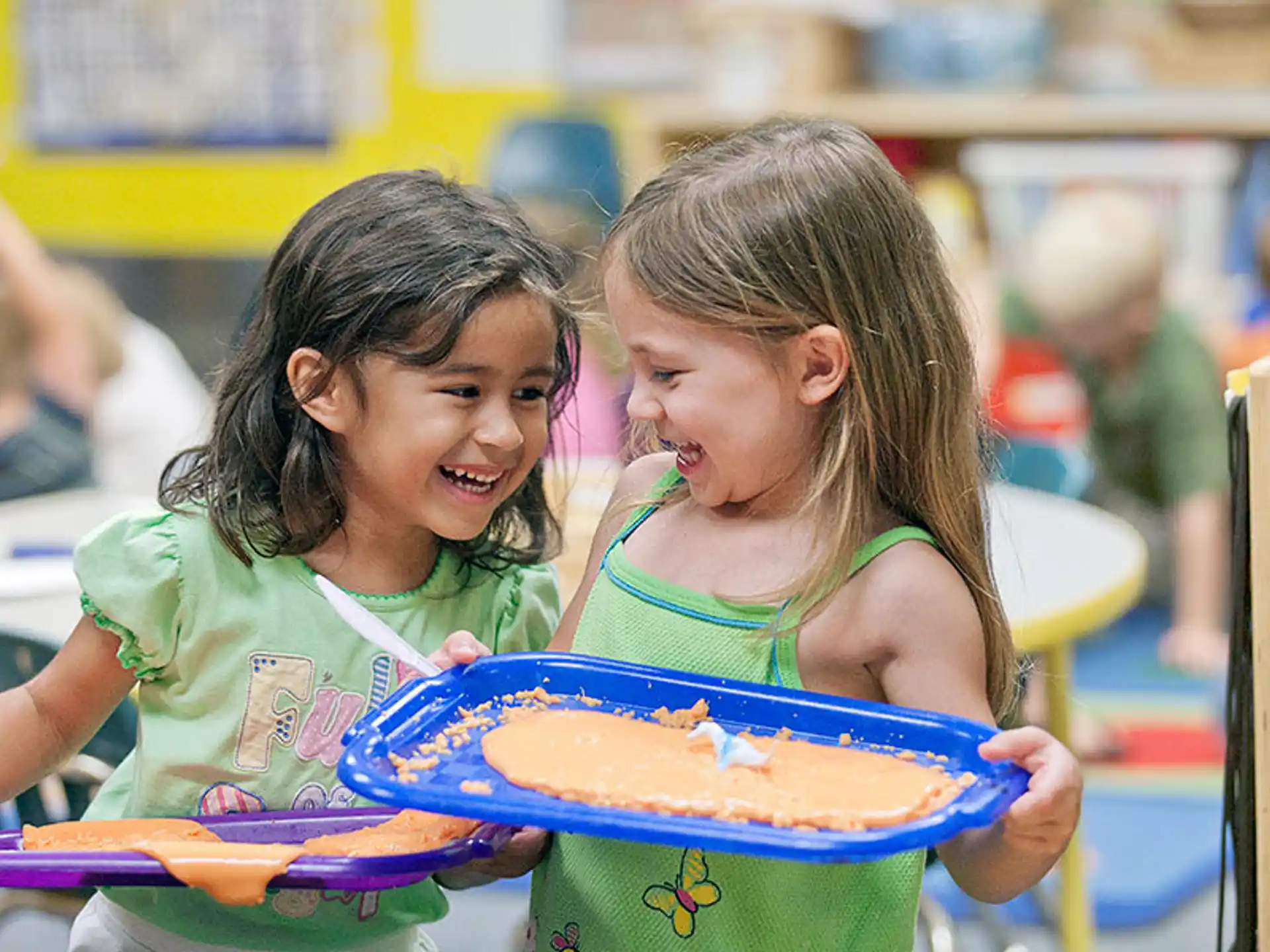 a couple of girls in a classroom