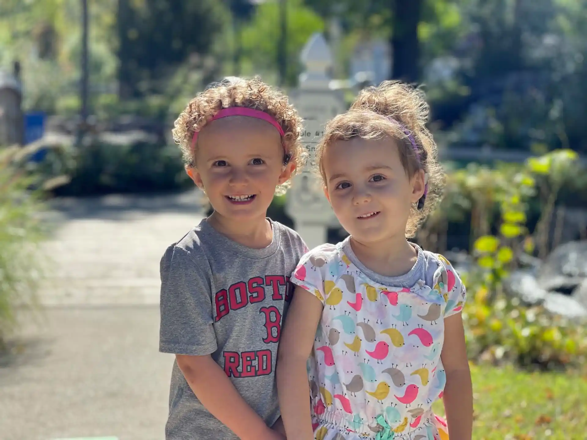 a couple of children posing for the camera