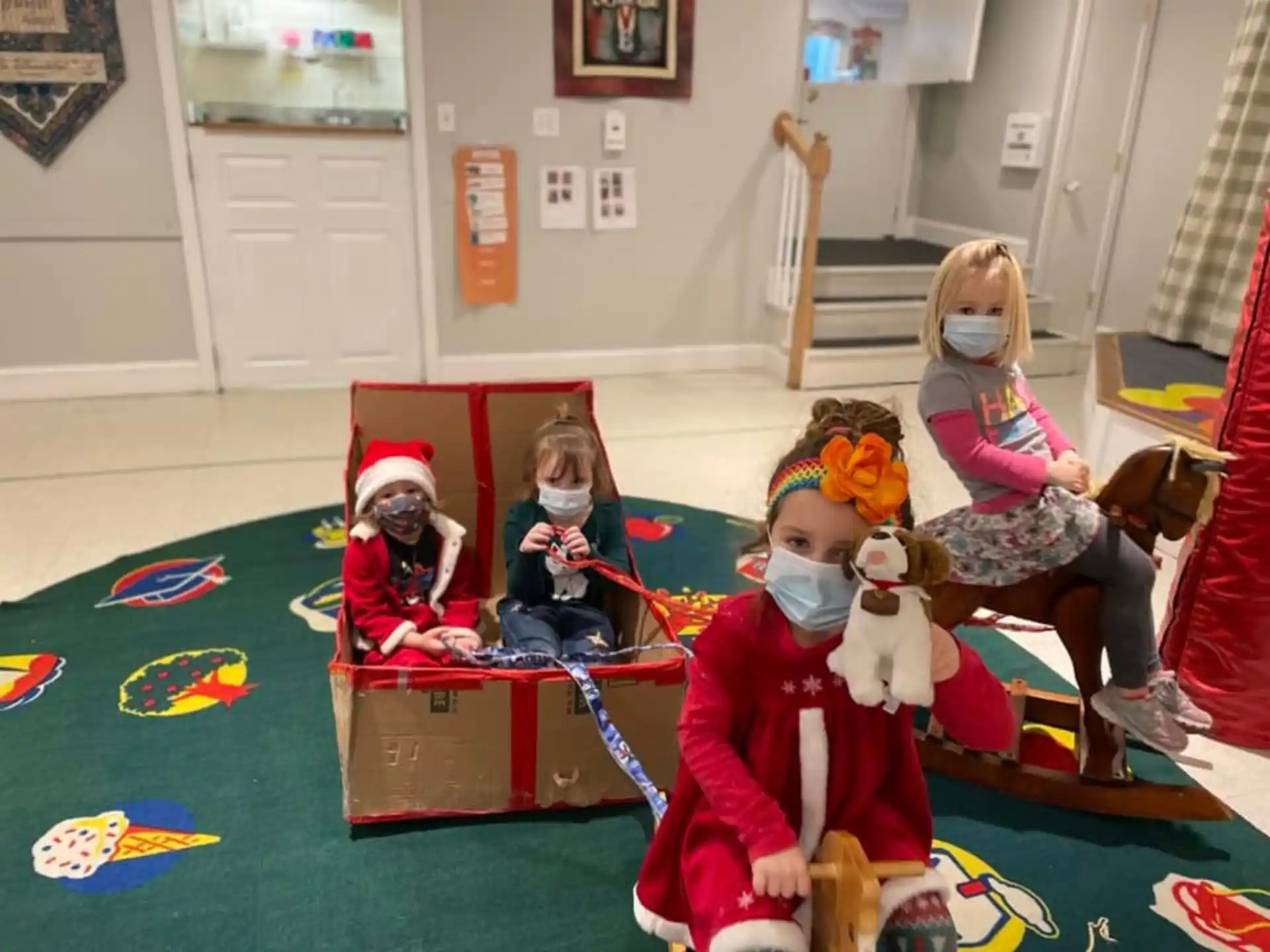 a group of children sitting on the floor with toys
