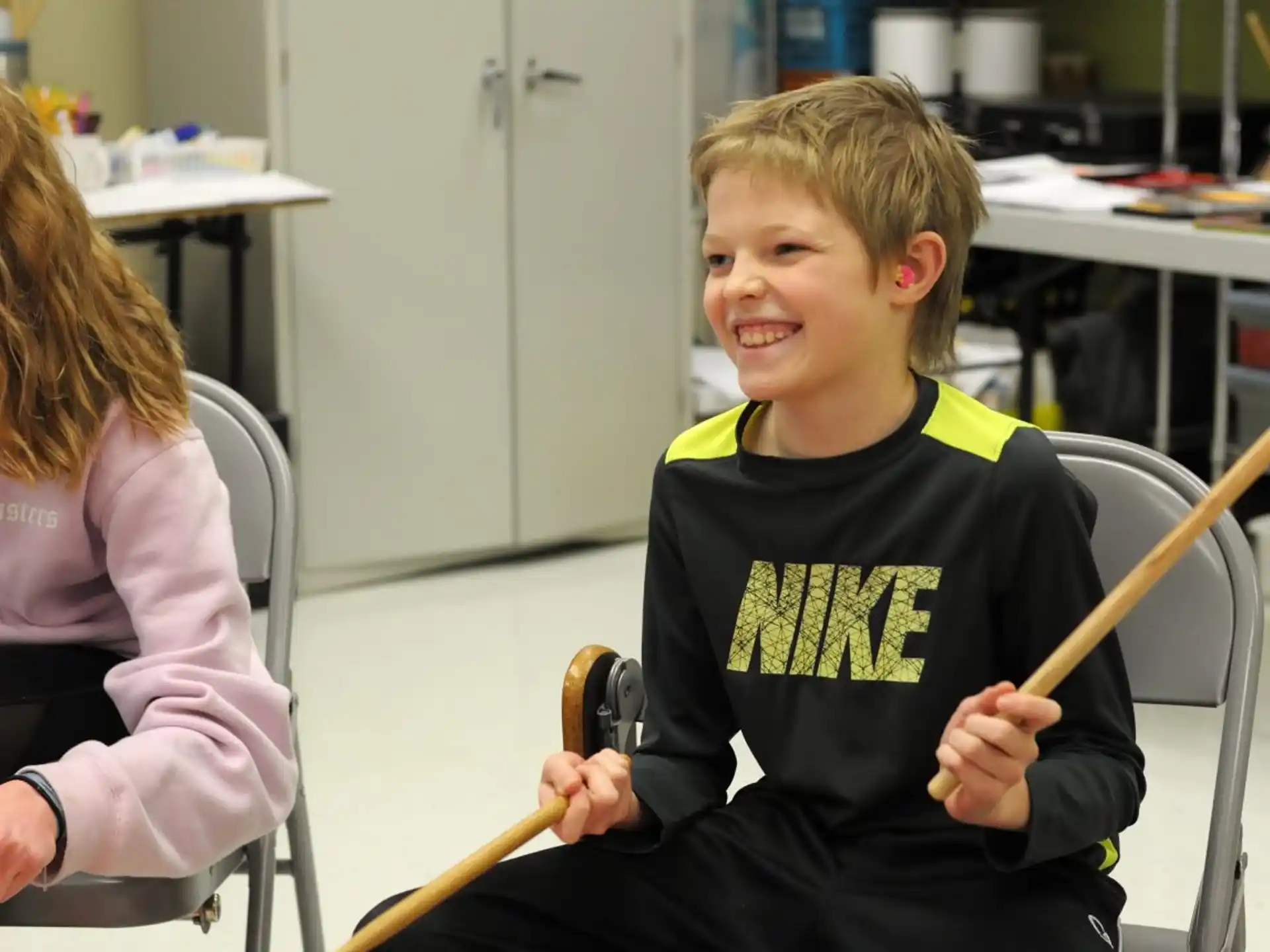 a boy and girl sitting in chairs