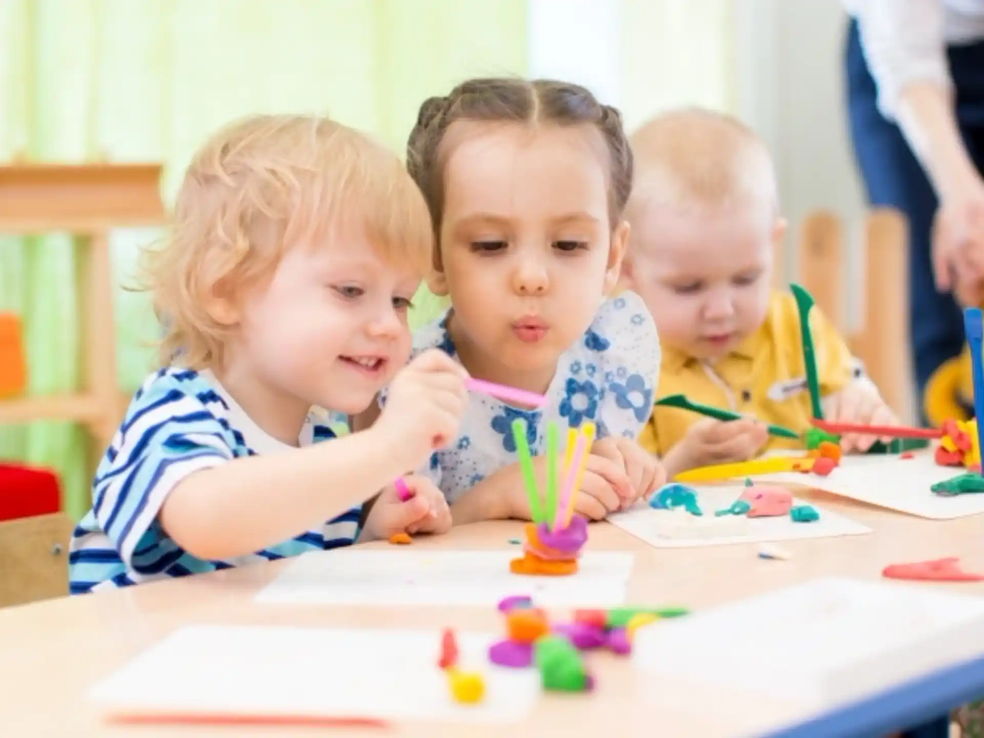 a group of children sitting at a table