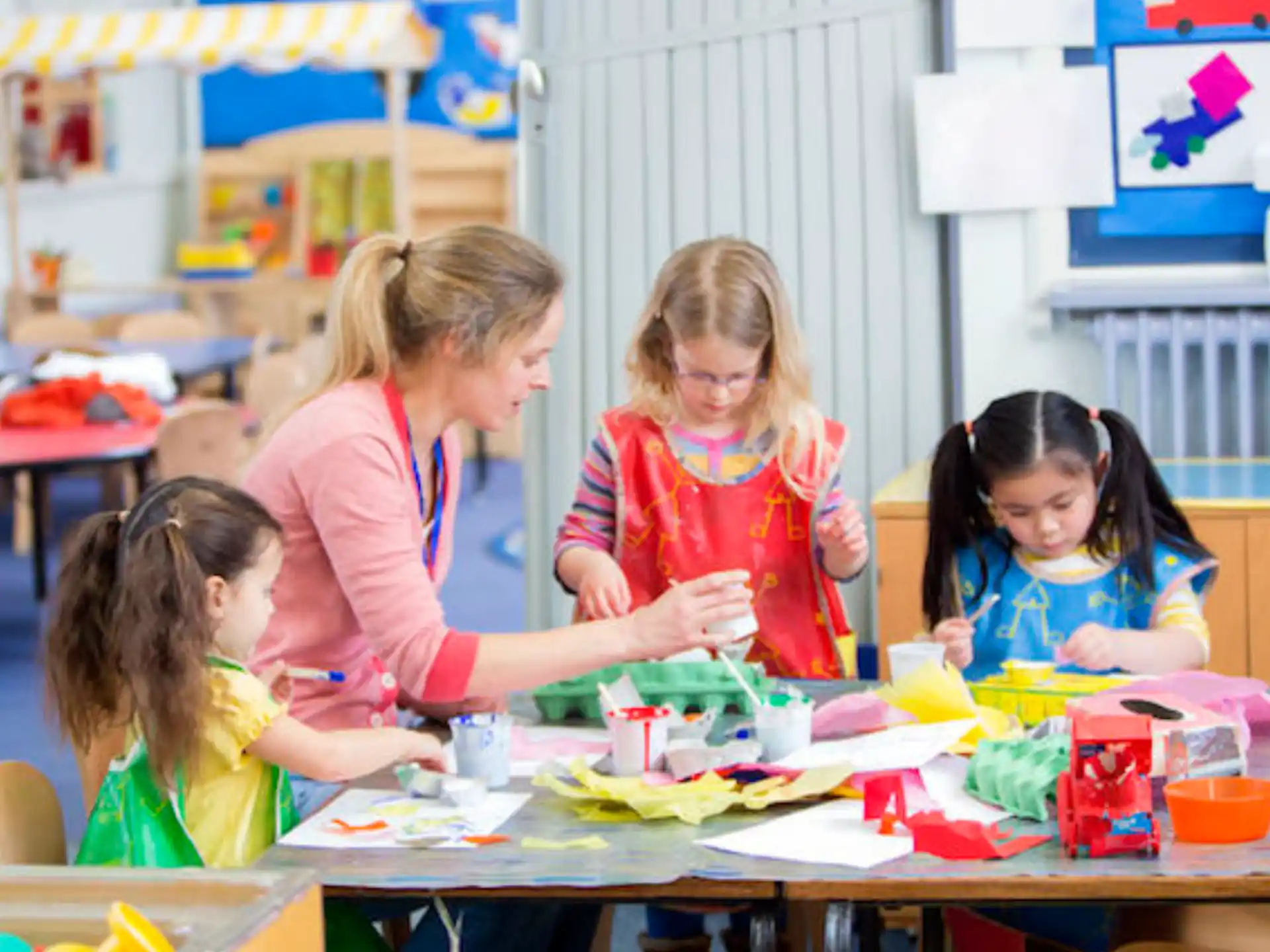 a group of children sitting at a table