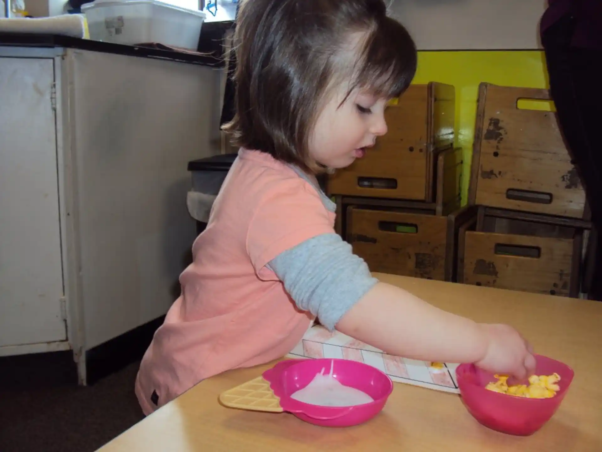 a girl sitting at a table